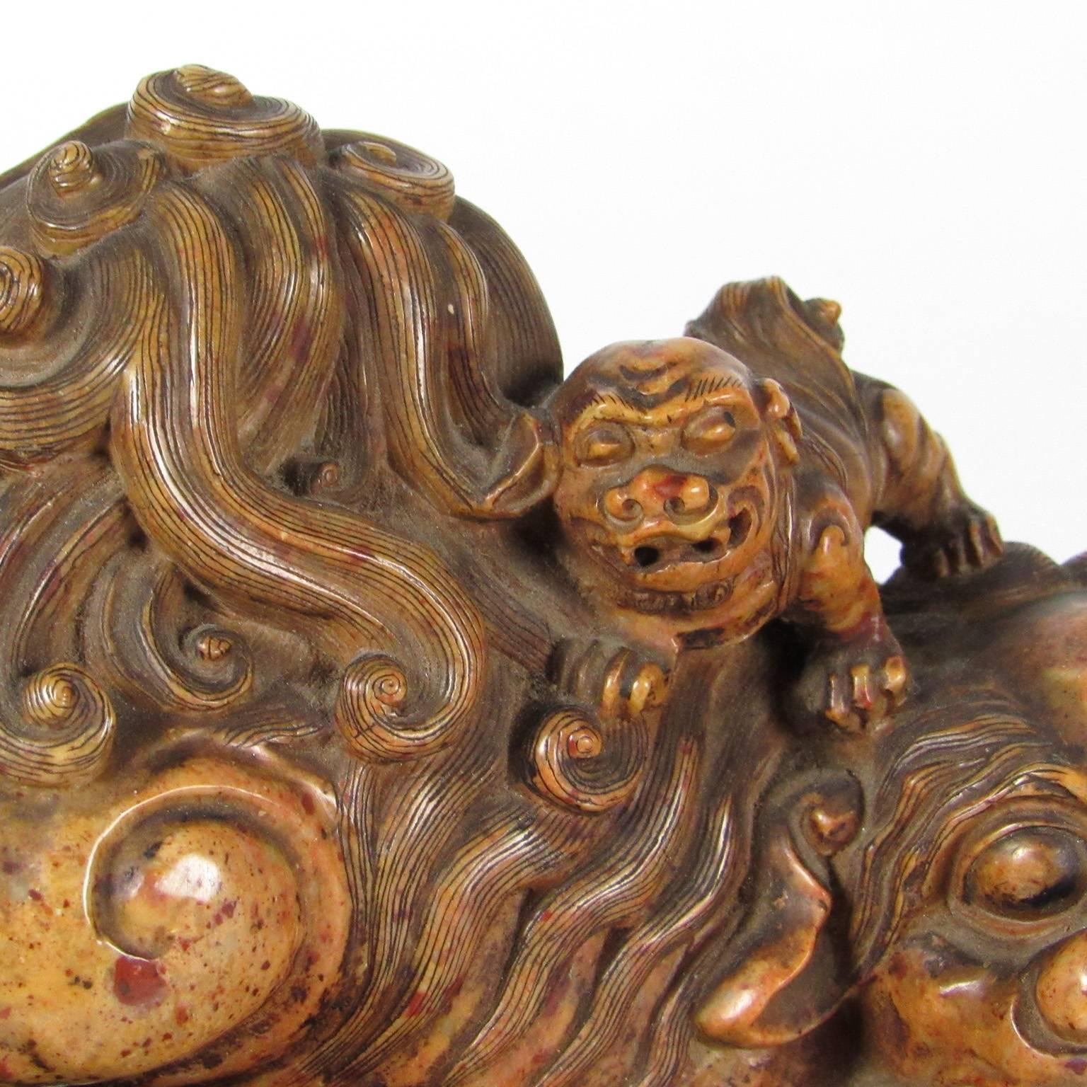 Excellent antique Chinese soapstone carving of a foo lion, with a litter of pups, 19th century. Excellent provenance available to buyer.
Dimensions: 6 x 8 1/2 x 4 inches.