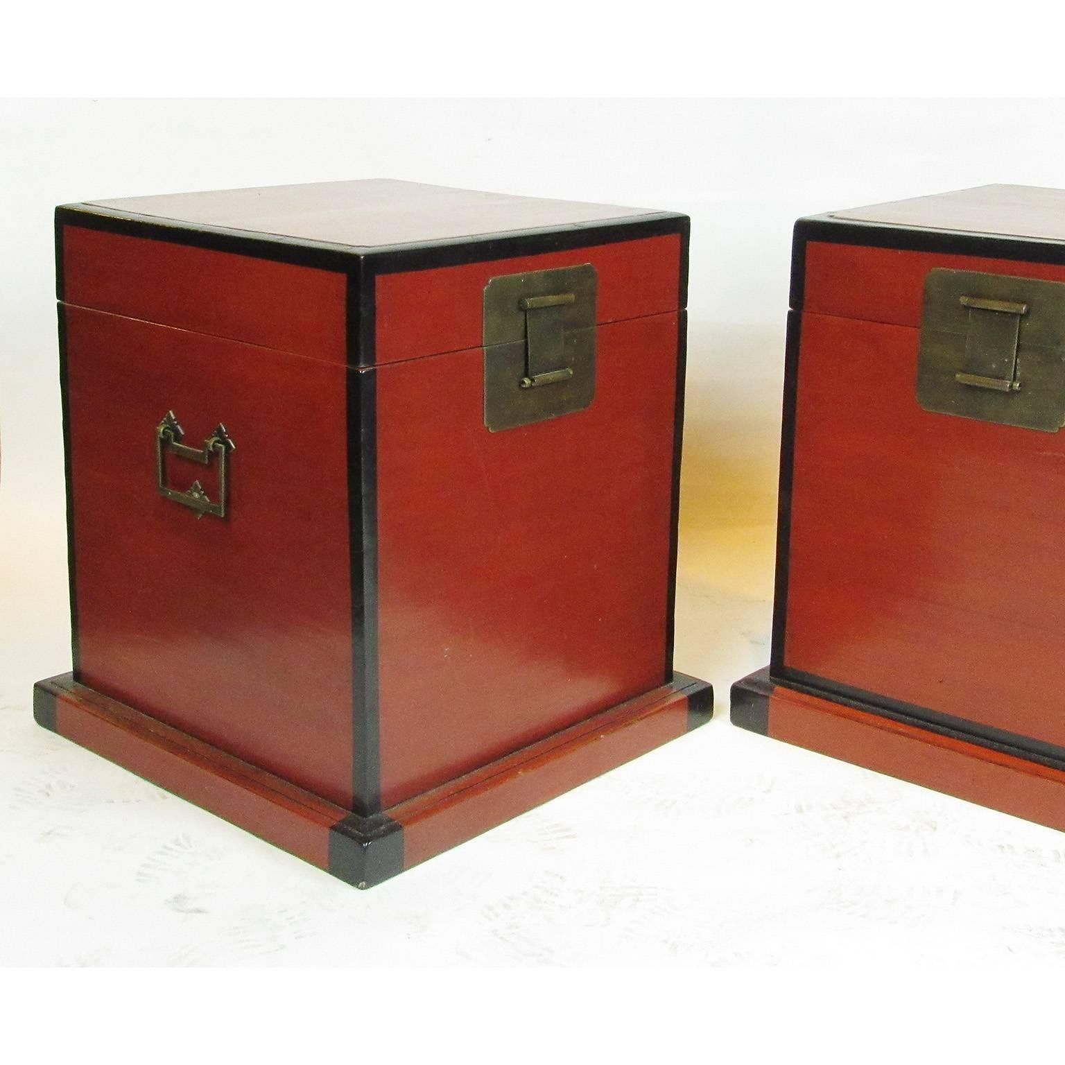 This pair of 19th century red lacquer chests make perfect side tables! Lift top, revealing an open compartment in black lacquer, with brass carrying handles on each side; 19 x 18 x 18 inches.