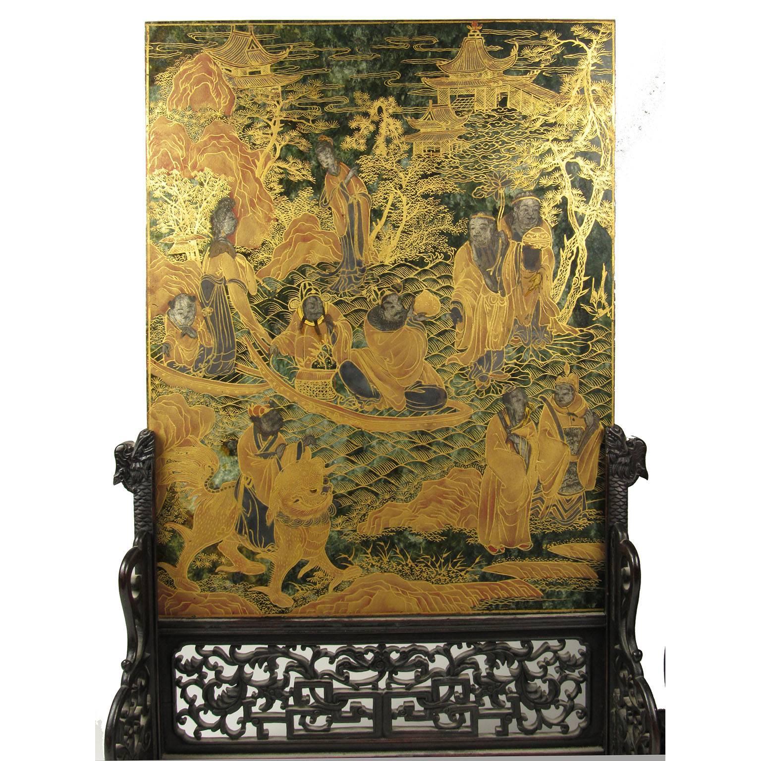 Exceptional pair of 19th century Chinese gilt decorated Spinach green jade table screens, on elaborately carved hardwood stands with dragon heads. Each screen with landscapes with figures on one side and birds on the other.
Measures: Jade: 15 3/4 x