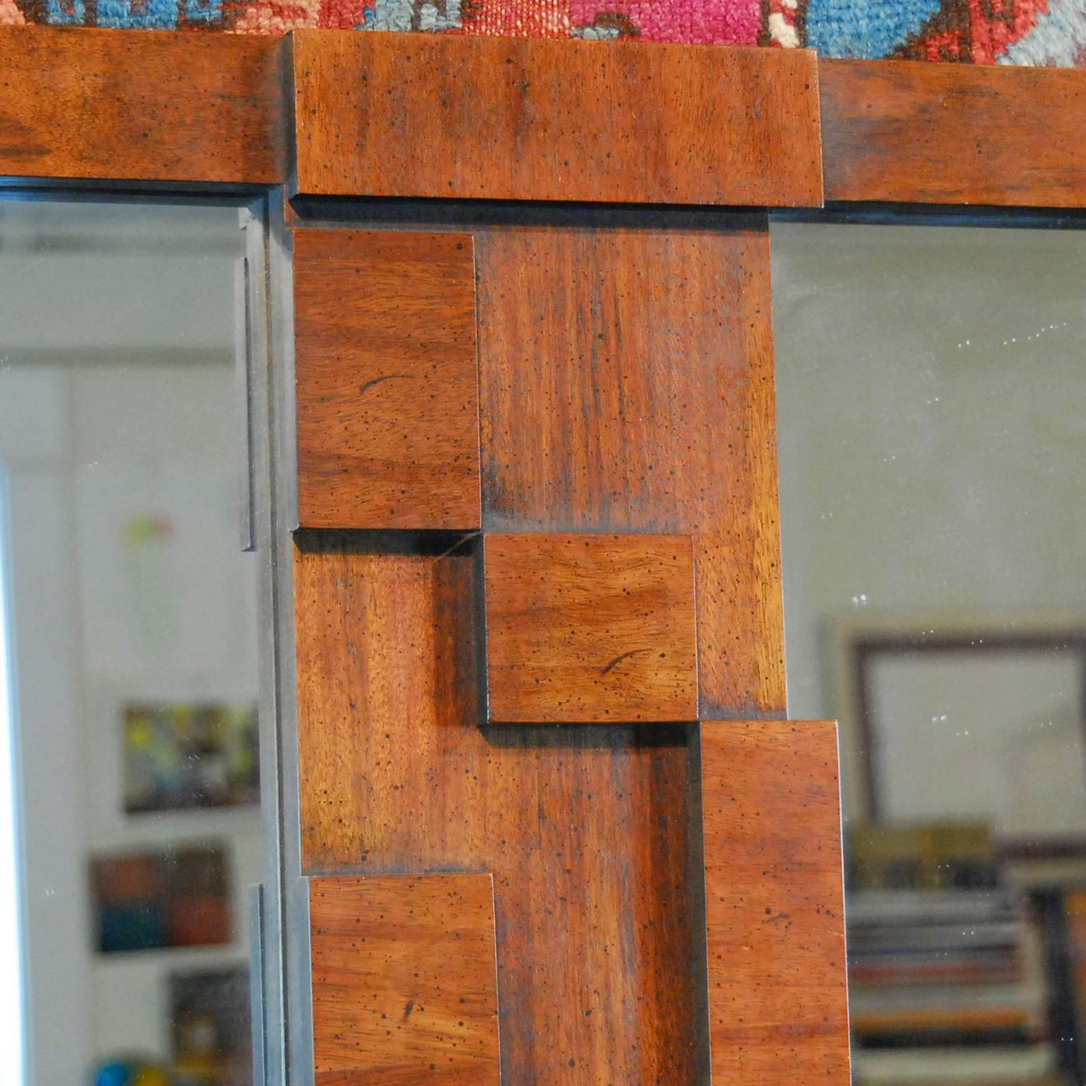 Mid-Century Modern Lane 'Paul Evans' style Brutalist walnut double mirror. Landscape over mantel mirror with rectangular blocks dividing each pane. Model and serial numbers 480-06/3570110.
Dimensions: 41 1/2 x 51 1/2 x 1 inch.