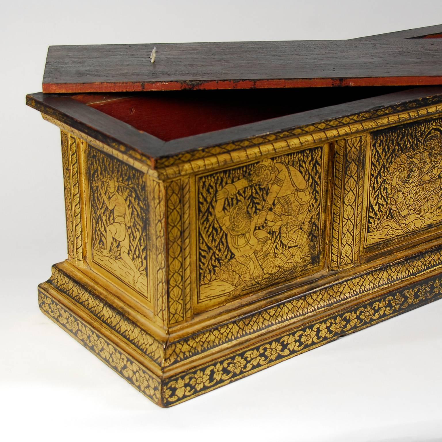 Antique thai gilt decorated manuscript box, late 19th century. Black lacquer base with ornate gilt decorative figural reserves on each side and on each end. Remove the lift top lid to reveal a red lacquer interior. Important provenance available to