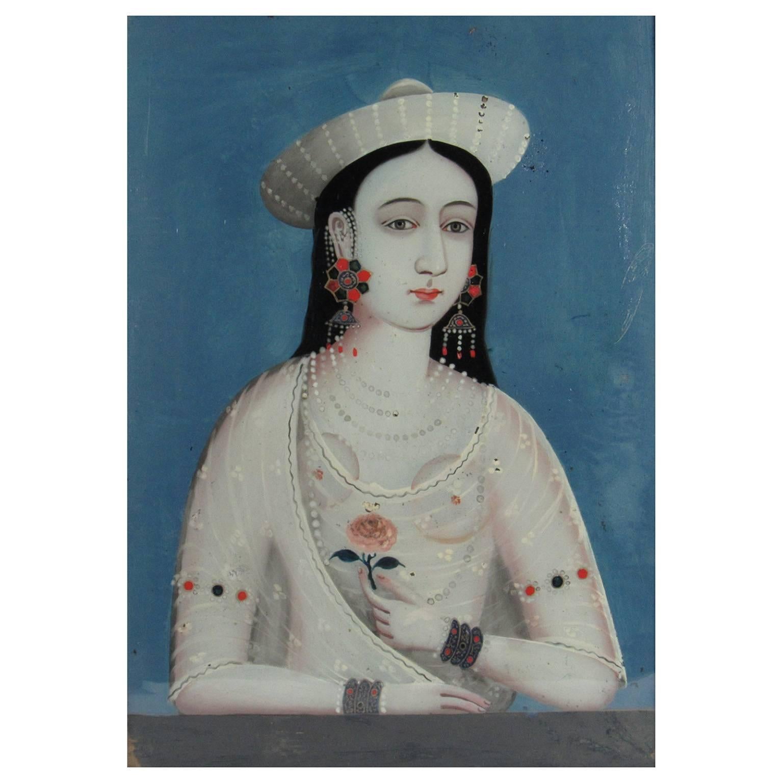 China Trade Reverse Painting on Glass Portrait of a Young Woman with Pink Flower, late 19th century.  Depicting a dark haired young woman rendered in entirely in white, symbolic of her purity and chastity.  She is wearing a white wide rimmed hat and