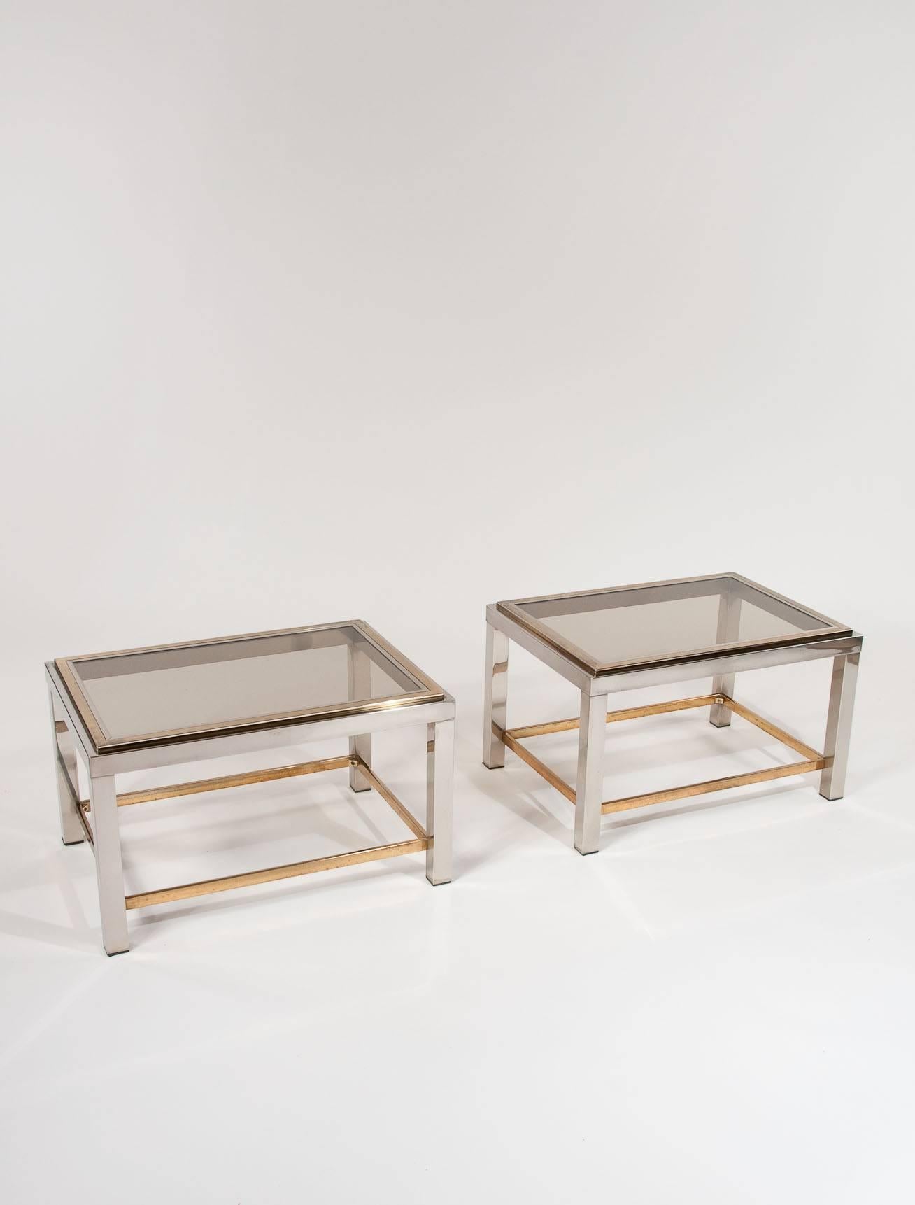 A pair of 1960s chrome and brass Willy Rizzo designed tables. This pair of Flaminia end/cocktail tables are one of the celebrated Italian designer Willy Rizzo's most iconic pieces of furniture, designed after the Rolex watch being bi metal steel and