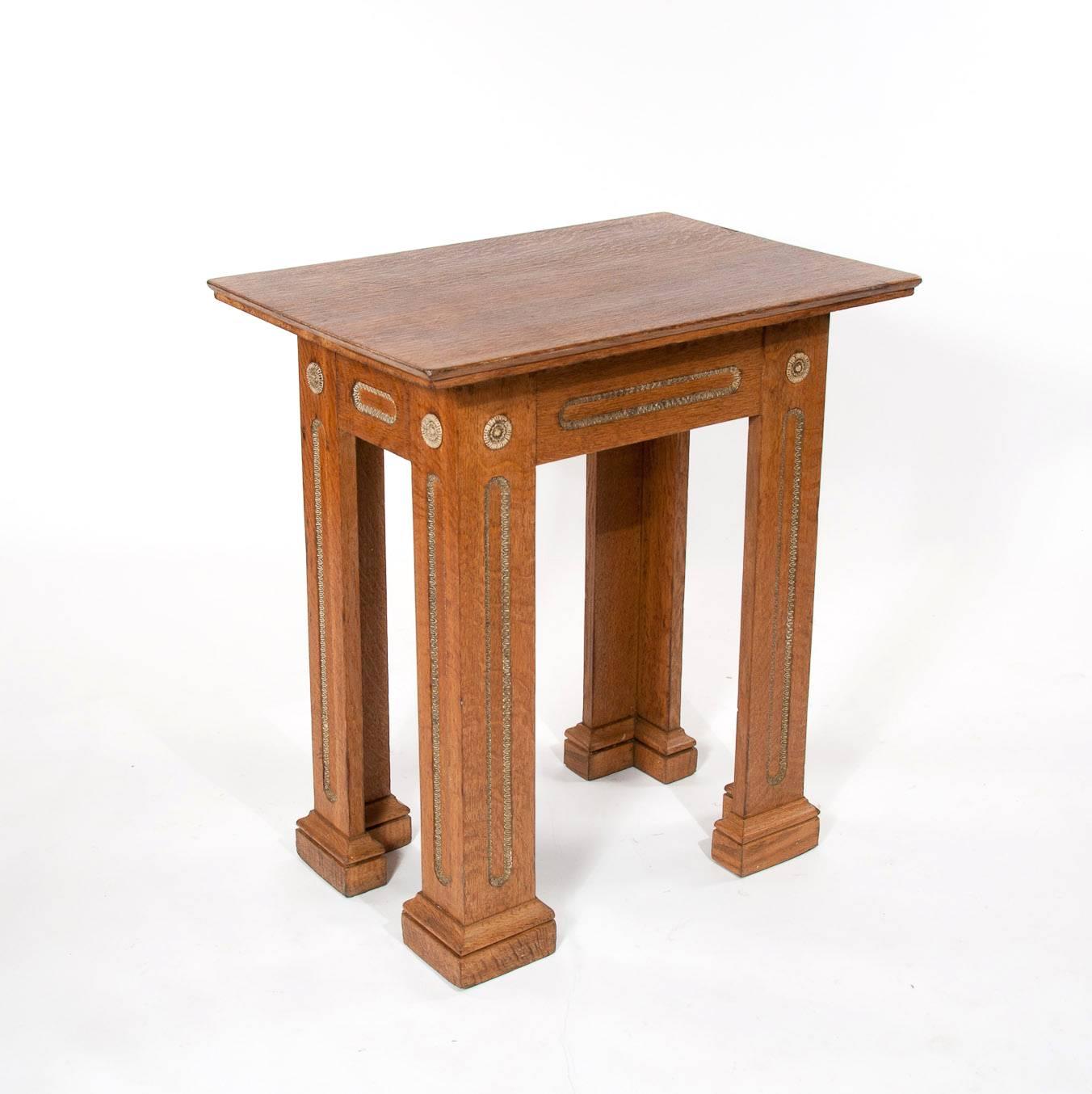 A very unusual and rare quality oak architectural table with carved resin mould decoration dating to 1920s.

The rectangular oak top over an architectural base with the frieze having inset carved carved resin mould decorations which follow down