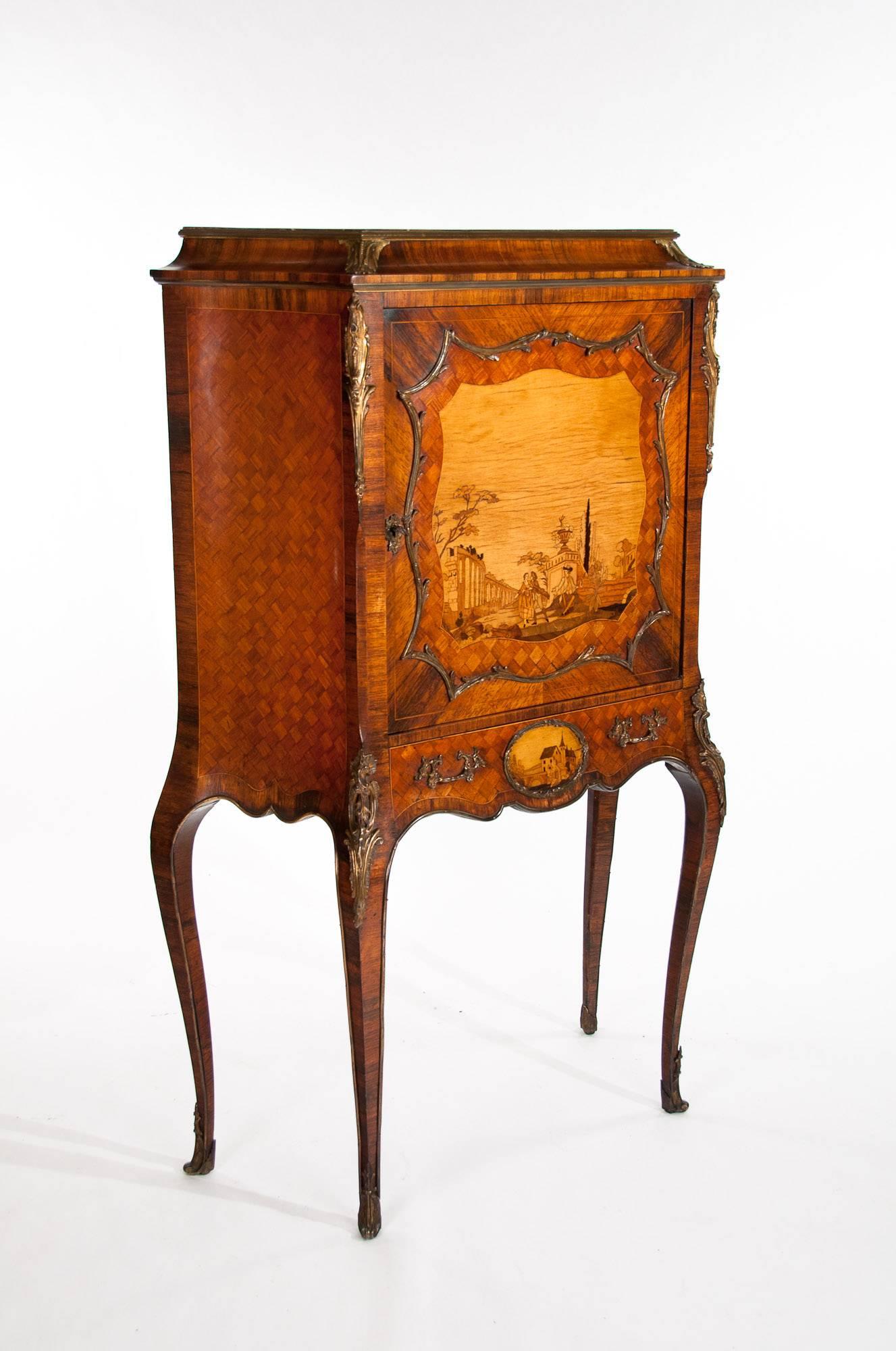 A very fine quality shaped Louis XV style French rosewood and gilt mounted marquetry and parquetry cabinet with marble top on shaped legs. 

This exquisite French cabinet dating to the late 19th century is in superb condition boasting a wonderful