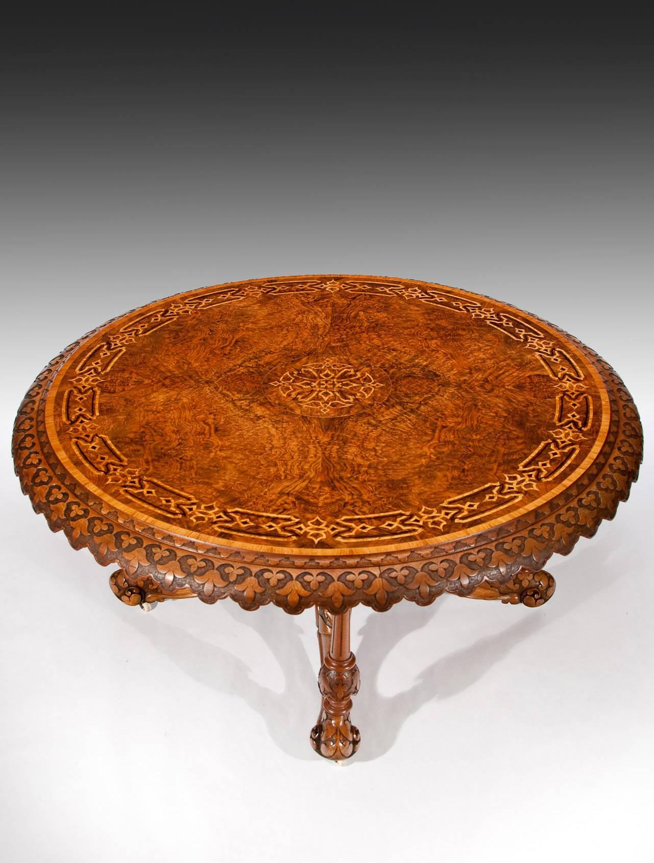 Victorian period burr walnut and bird's-eye maple marquetry antique centre table, circa 1860. 
The large circular top finely veneered in a beautifully figured burr walnut with bird's-eye maple and a purple heart marquetry central panel having a