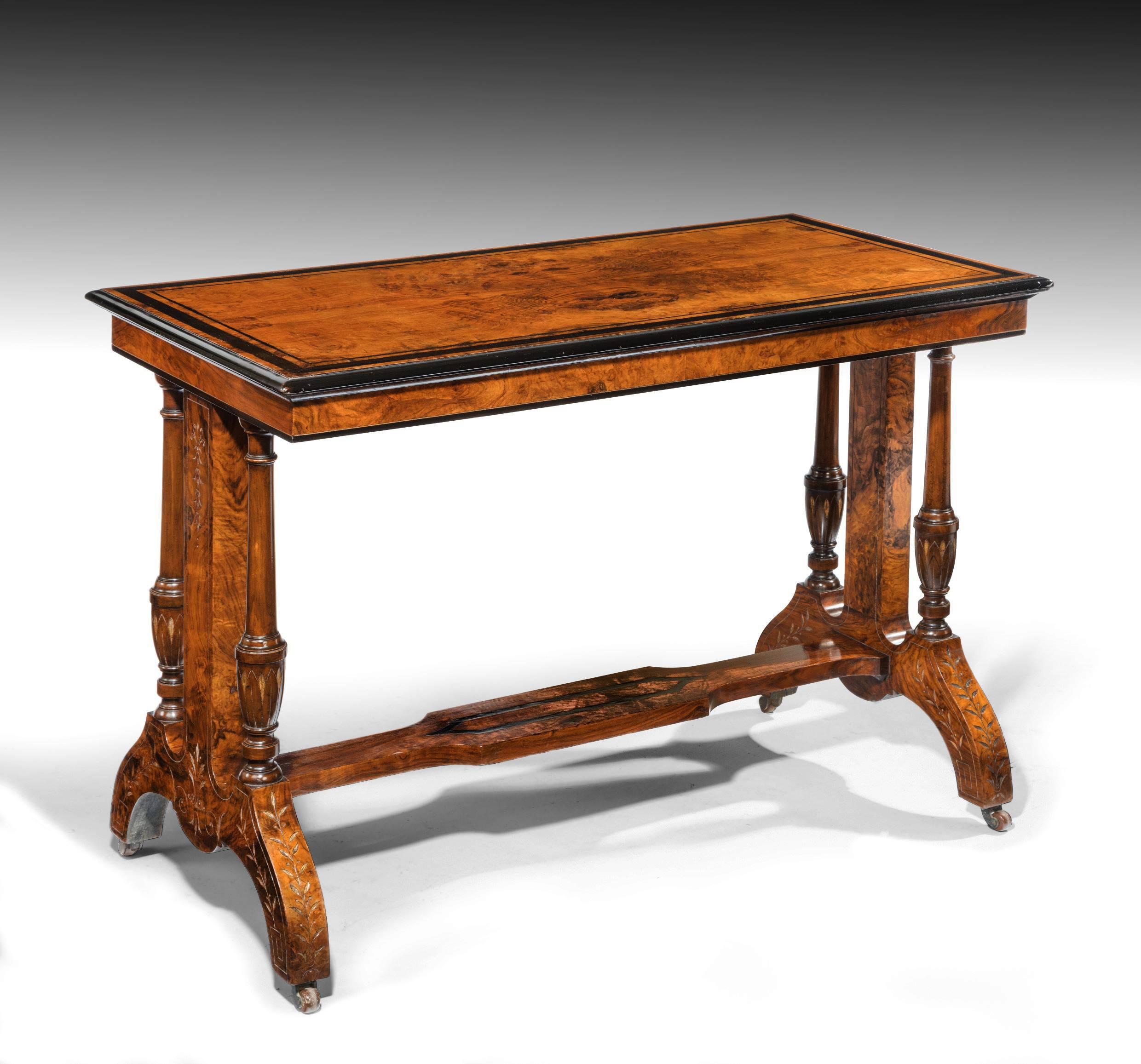 A quality Victorian figured walnut and ebony inlay table. 
Extremely well constructed using good carving and fine veneers this Victorian table dates to circa 1860. 
The rectangular top being in figured walnut having ebony inlay and banding with an