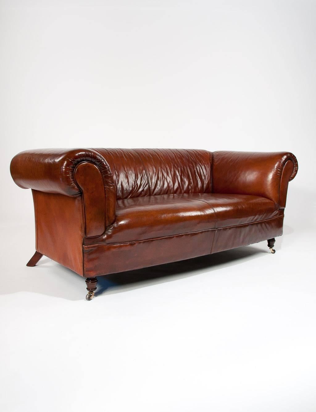 A very comfortable and well proportioned Mid 20Th Century tan / brown leather upholstered chesterfield. This very good quality leather chesterfield has extremely good proportions and in excellent condition retaining its original tan / brown leather.
