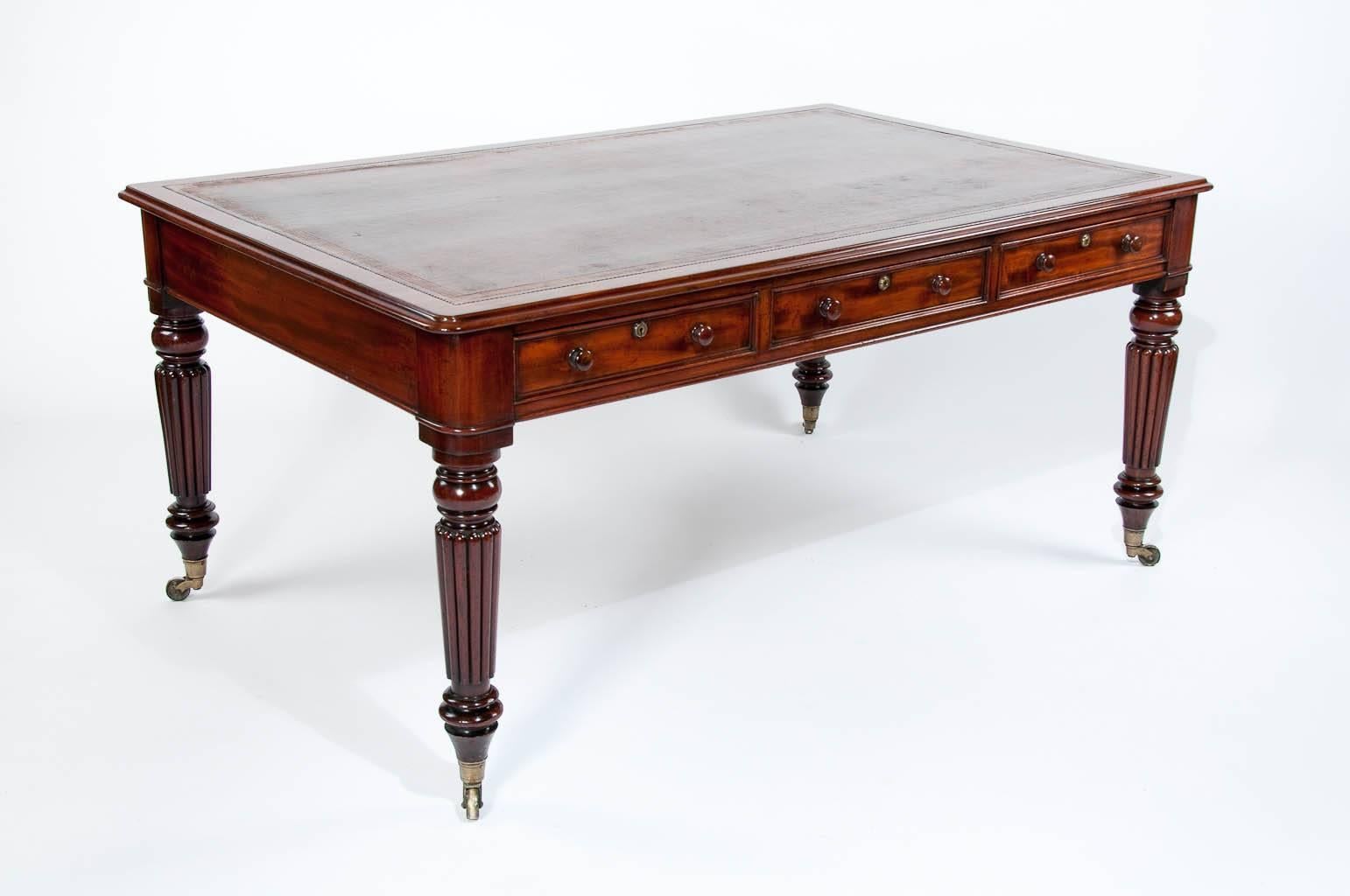 A stunning six-drawer mahogany partners writing table / desk stamped M Wilson of 68 Great Queens Street, London. Constructed of the finely quality with very select timbers used this early 19th century Partners writing table dates to the late Regency