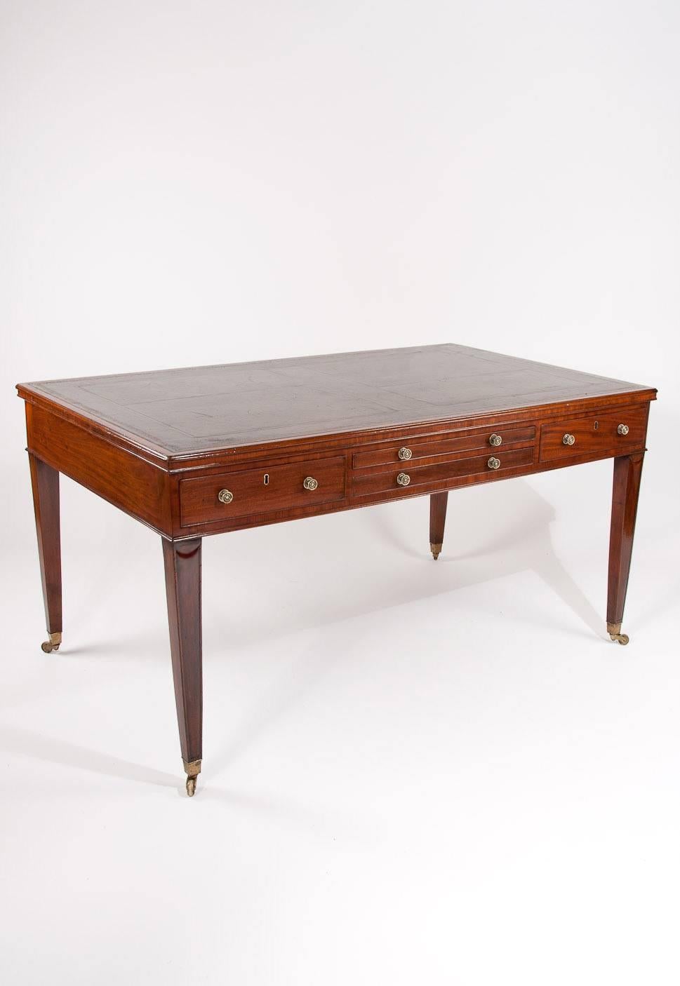 A very rare and fine quality mahogany Georgian partners writing table / desk with pull out adjustable reading / writing slide. This extremely rare writing table is made from the finest mahogany timbers with a rectangular leather inserted top with