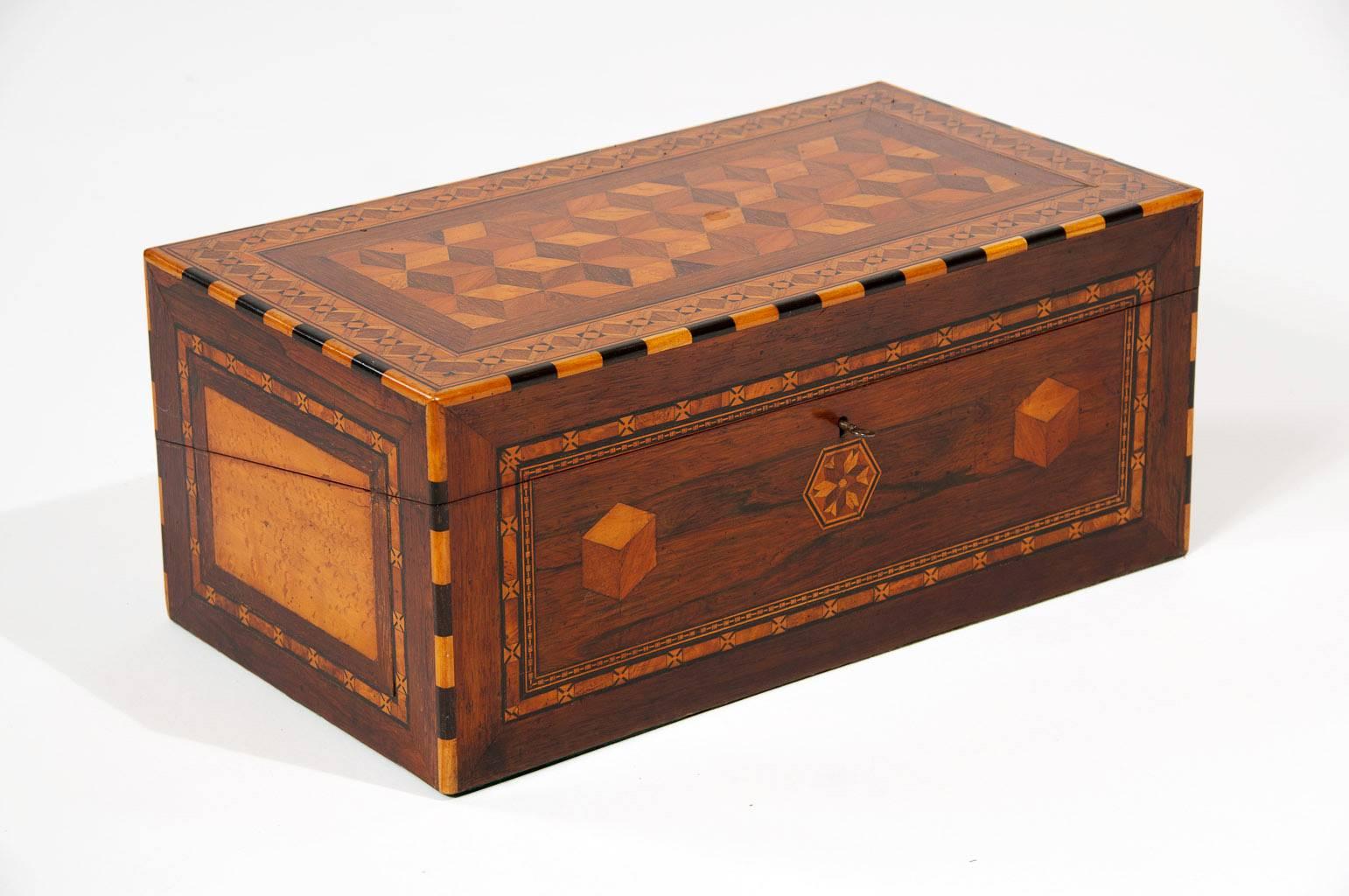 An exceptionally good quality 19th century geometric marquetry and parquetry writing slope of good size and proportions. This well sized mid 19th century writing slope / box has been made to highest standard with extremely fine parquetry and use of