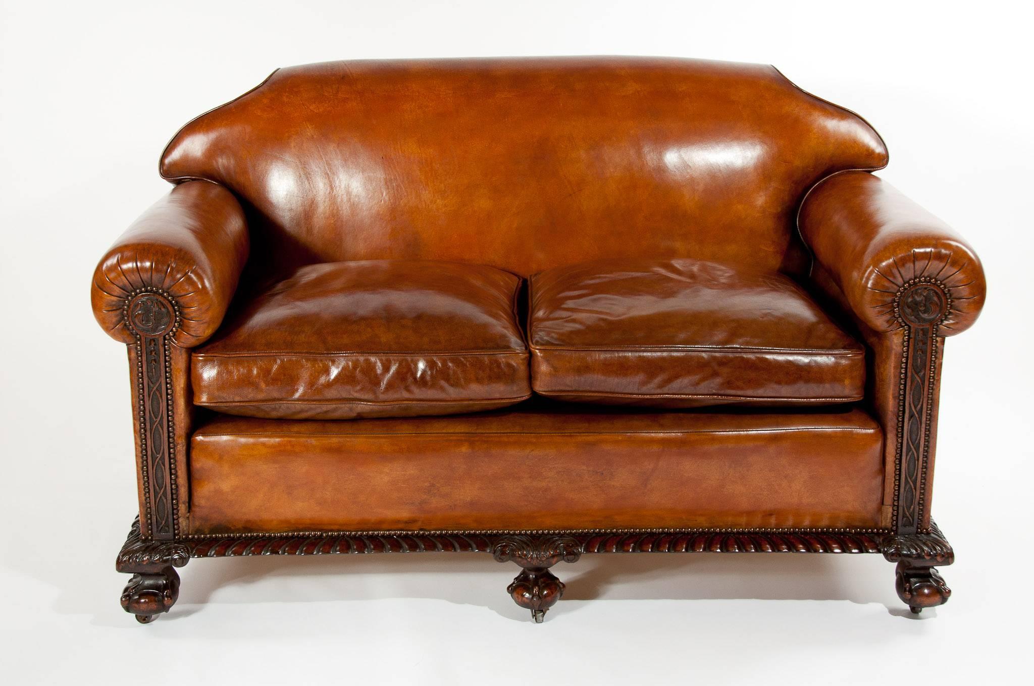 A delightful and extremely well proportioned Victorian leather upholstered mahogany sofa and armchairs, three-piece suite. The suite retains an old leather having original horsehair stuffing beneath which is still intact with feather down cushions.