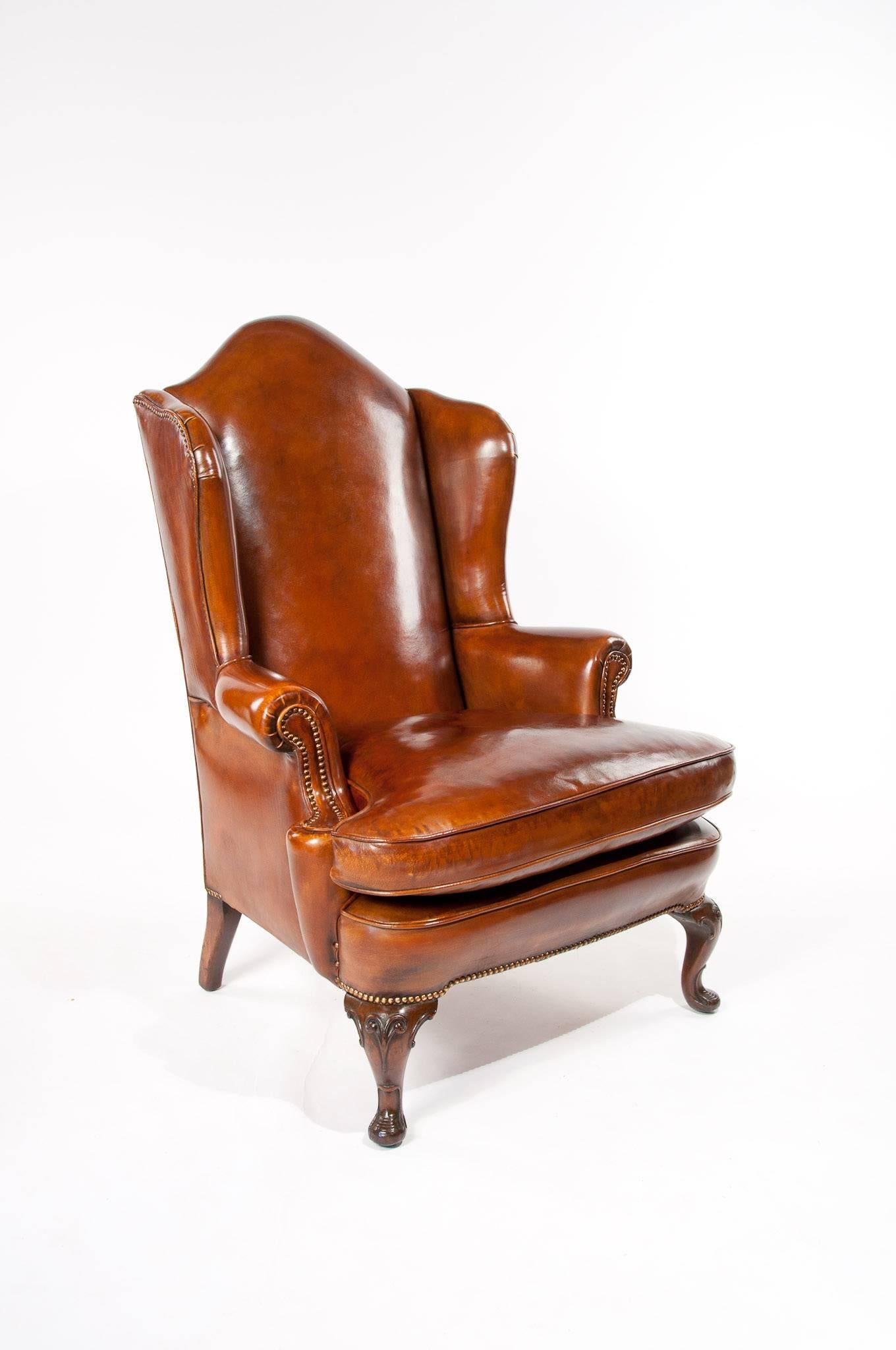 Superb quality antique walnut leather wing chair, mid-19th century having wonderful proportions.
A very good quality walnut leather upholstered wing chair of good proportions dating to circa 1850. This antique leather wing chair is of fine quality