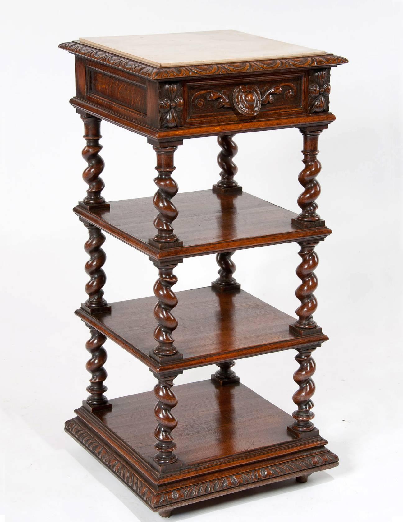 A very good quality 19th century oak Victorian marble topped four-tier whatnot. 

Having a square inset marble top with carved moulded edge above a paneled frieze with inset carved oak lined drawer. The three lower tiers support by quality ring