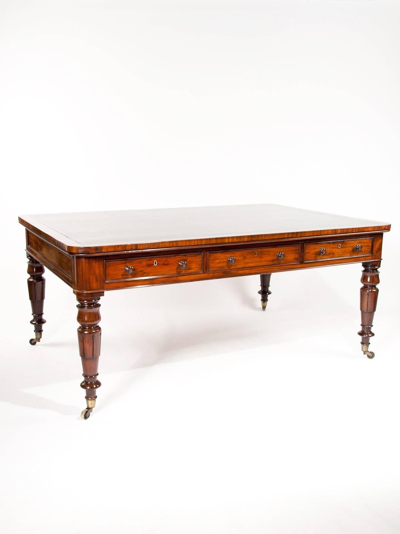 A superb quality antique mahogany partners library / writing table desk dating to circa 1840.
This large antique partners library table has been constructed with the use of the finest mahogany timbers of its period which have mellowed to a