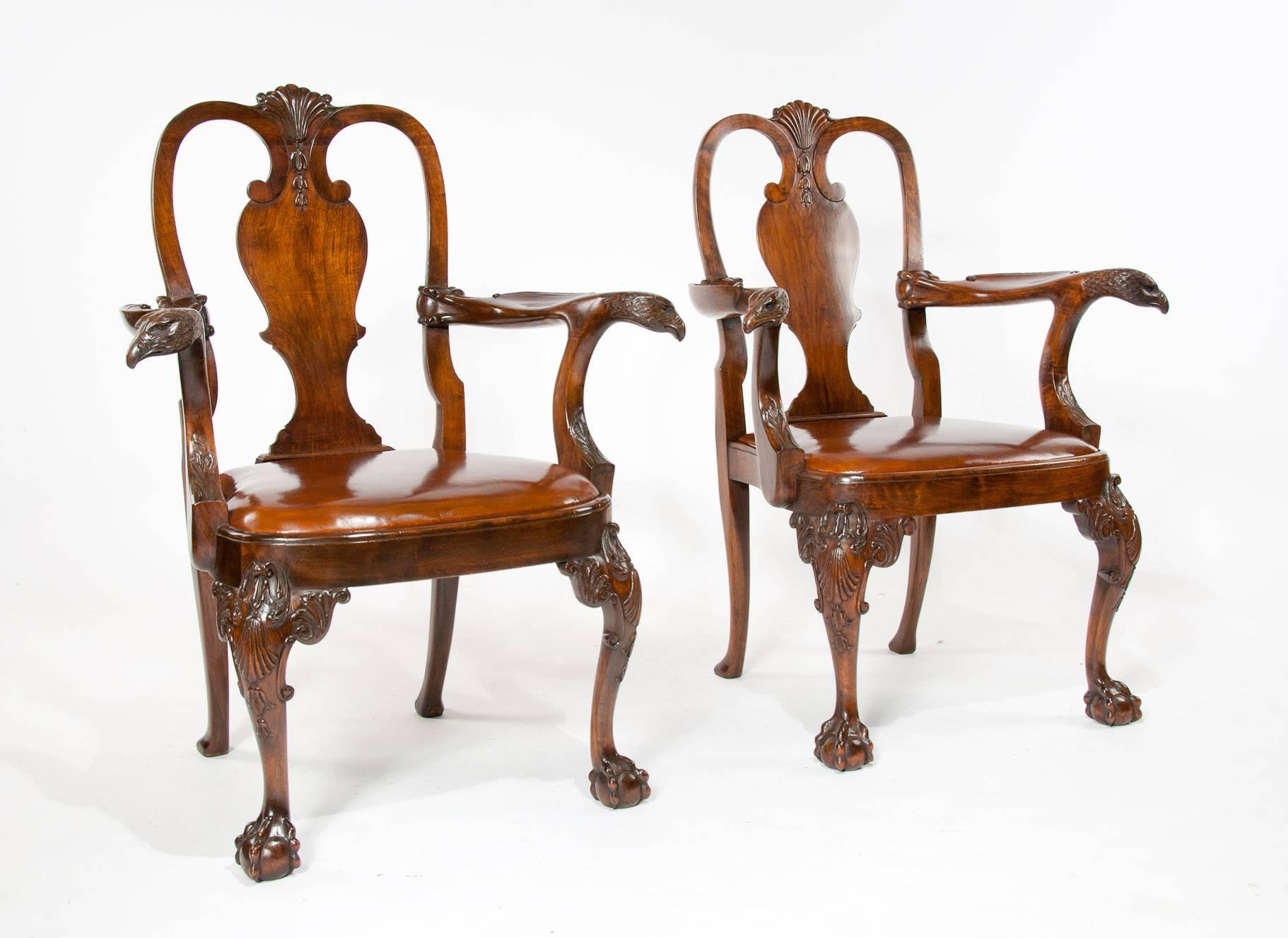 An extremely good pair of antique walnut desk armchairs with leather seats. 
A fine example of a excellent craftsmanship from the 1900s these chairs have been designed to be on display as well as being a practical pair of chairs which would have