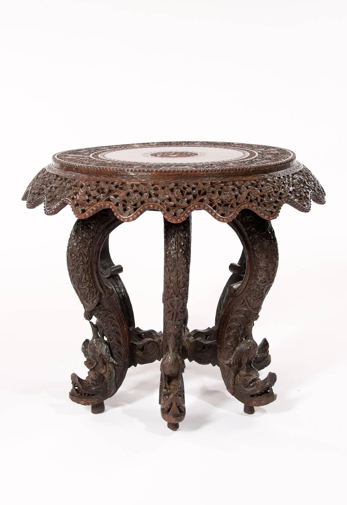 An impressive 19th century Anglo-Indian carved revolving occasional table.
A highly decorative and finely carved mid-19th century teak revolving occasional table or coffee table on a six legged base.
Extremely well carved and in excellent
