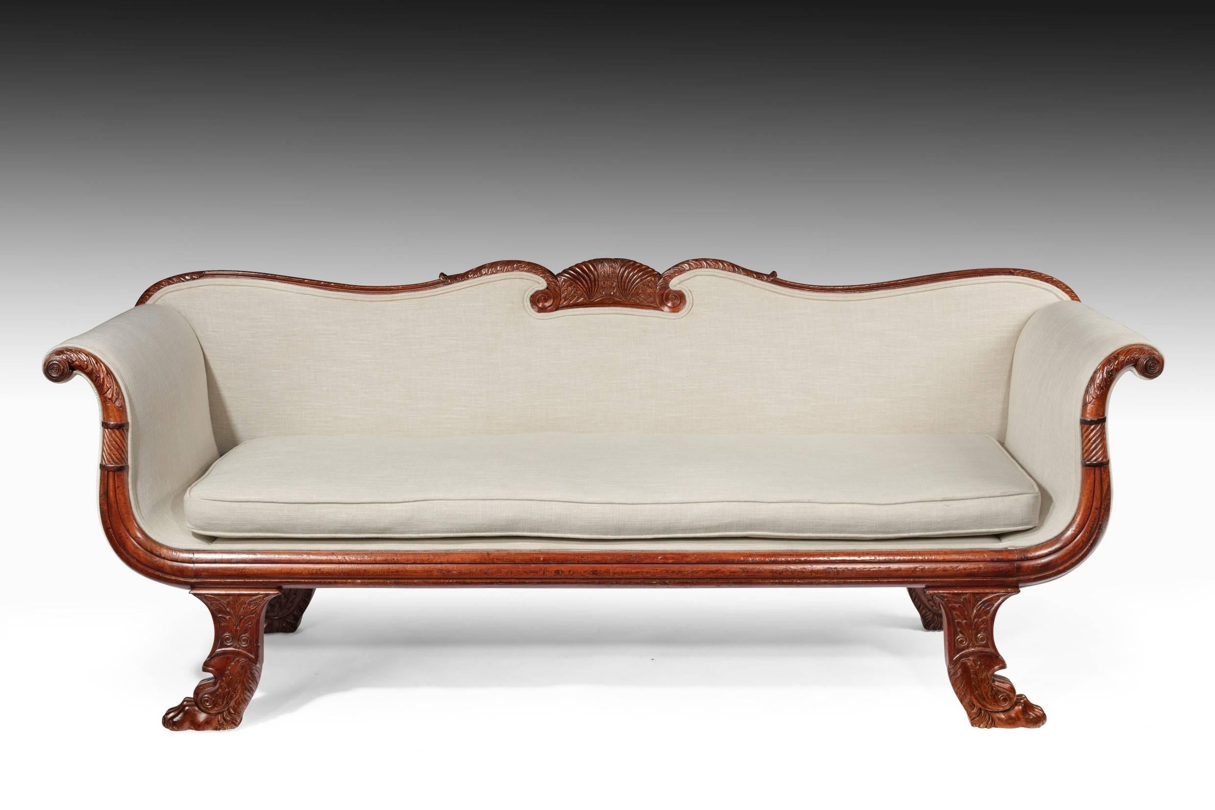 An elegant early 19th century mahogany sofa / couch dating to the late Regency / William IV period, circa 1830.
This very well drawn and elegant sofa has been constructed to the highest standards.
The crisply carved shaped back having a central