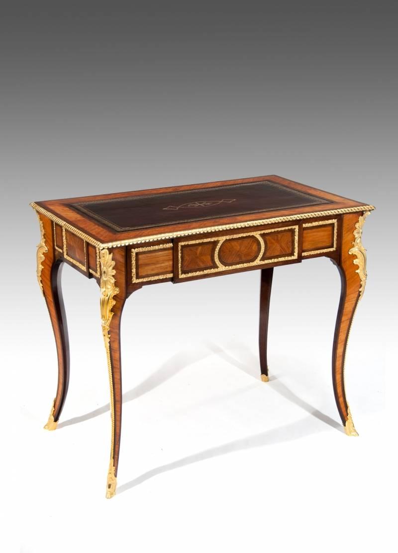 An extremely fine 19th century French Louis XV revival gilt ormolu-mounted Kingwood bureau de dame / writing table. Very attractive and of the finest quality this kingwood bureau de dame or ladies writing table dates to circa 1870. 
The rectangular