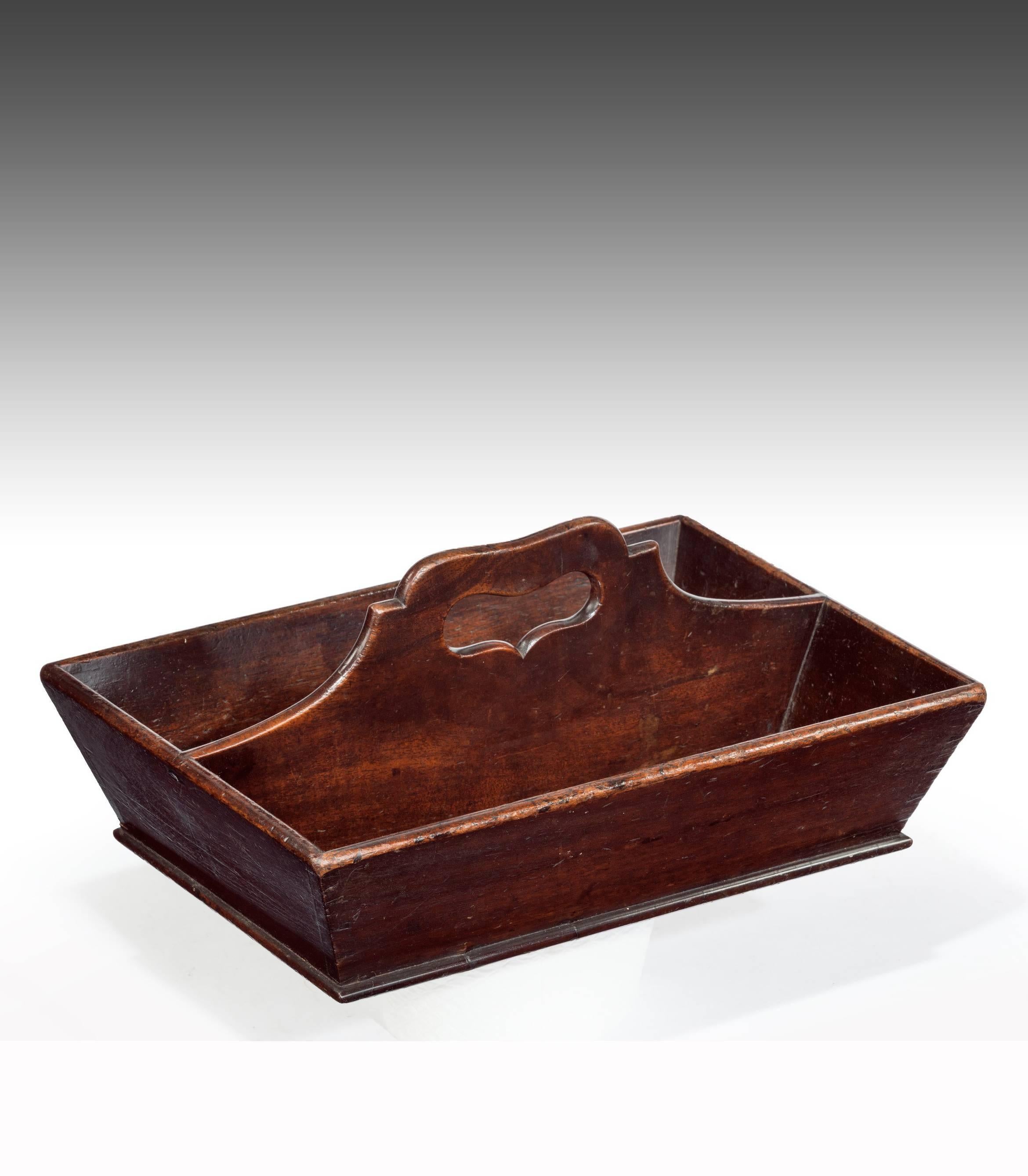A Fine antique Georgian mahogany cutlery tray or knife box. 
Having two sections with raised and heart shaped pierced central carrying handle constructed of a Fine cut of mahogany. 
This Georgian tray retains its original patina having been waxed