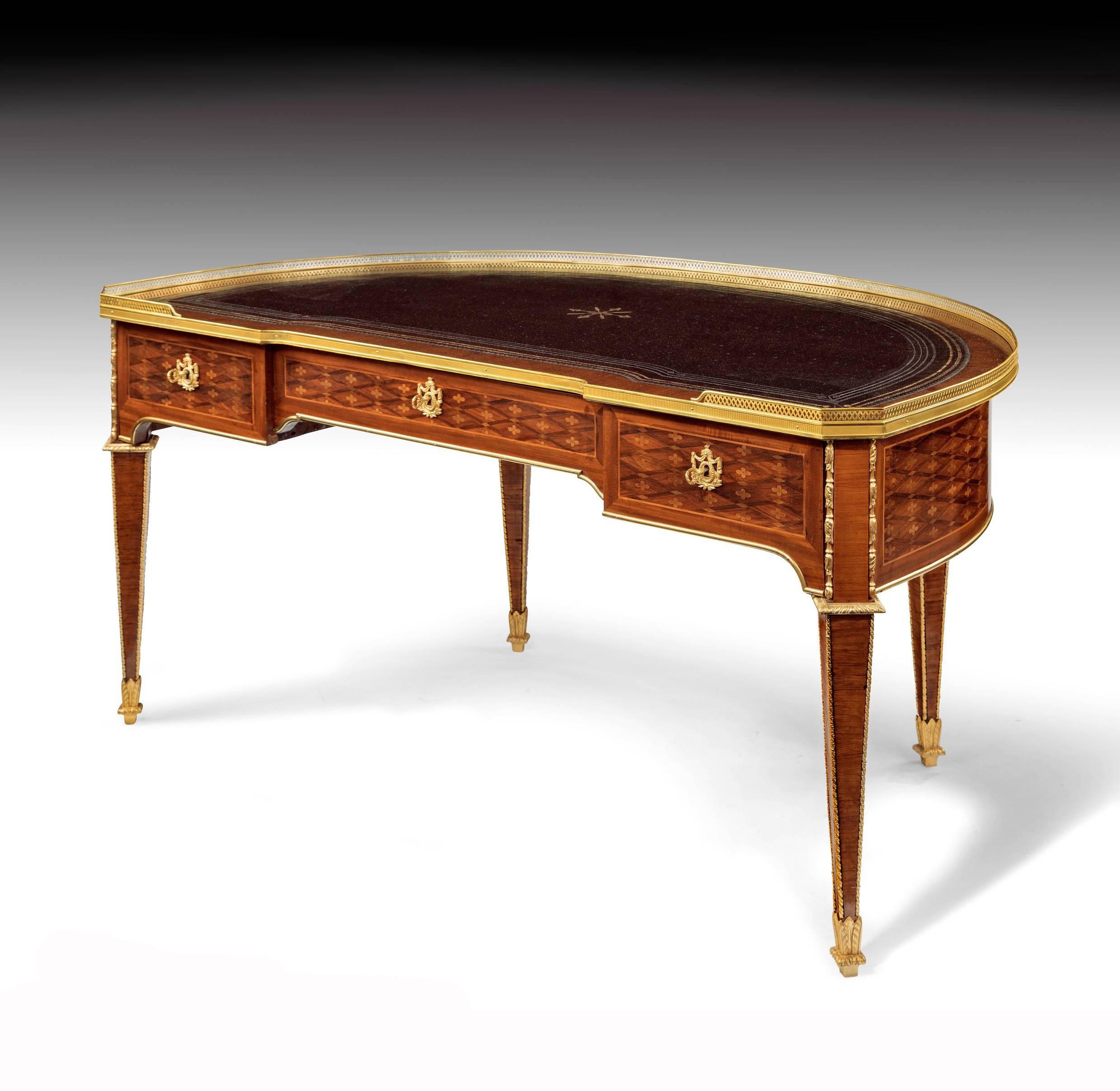 A stunning rare 19th century demilune, crescent shaped French desk in the Louis XVI style.
This delightful tulipwood late 19th century desk is one of the rarest shapes being demilune crescent shaped.
The inverted breakfront top having a gilt