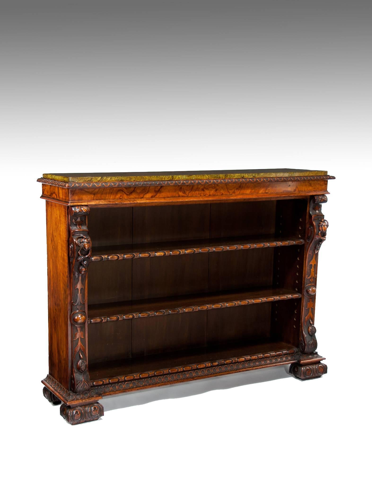 A superb quality 19th century walnut open bookcase and bookshelves.
Of excellent form and proportions being constructed of finely figured Victorian walnut with ornate crisp carvings dating to circa 1850.
The recessed top having a removable