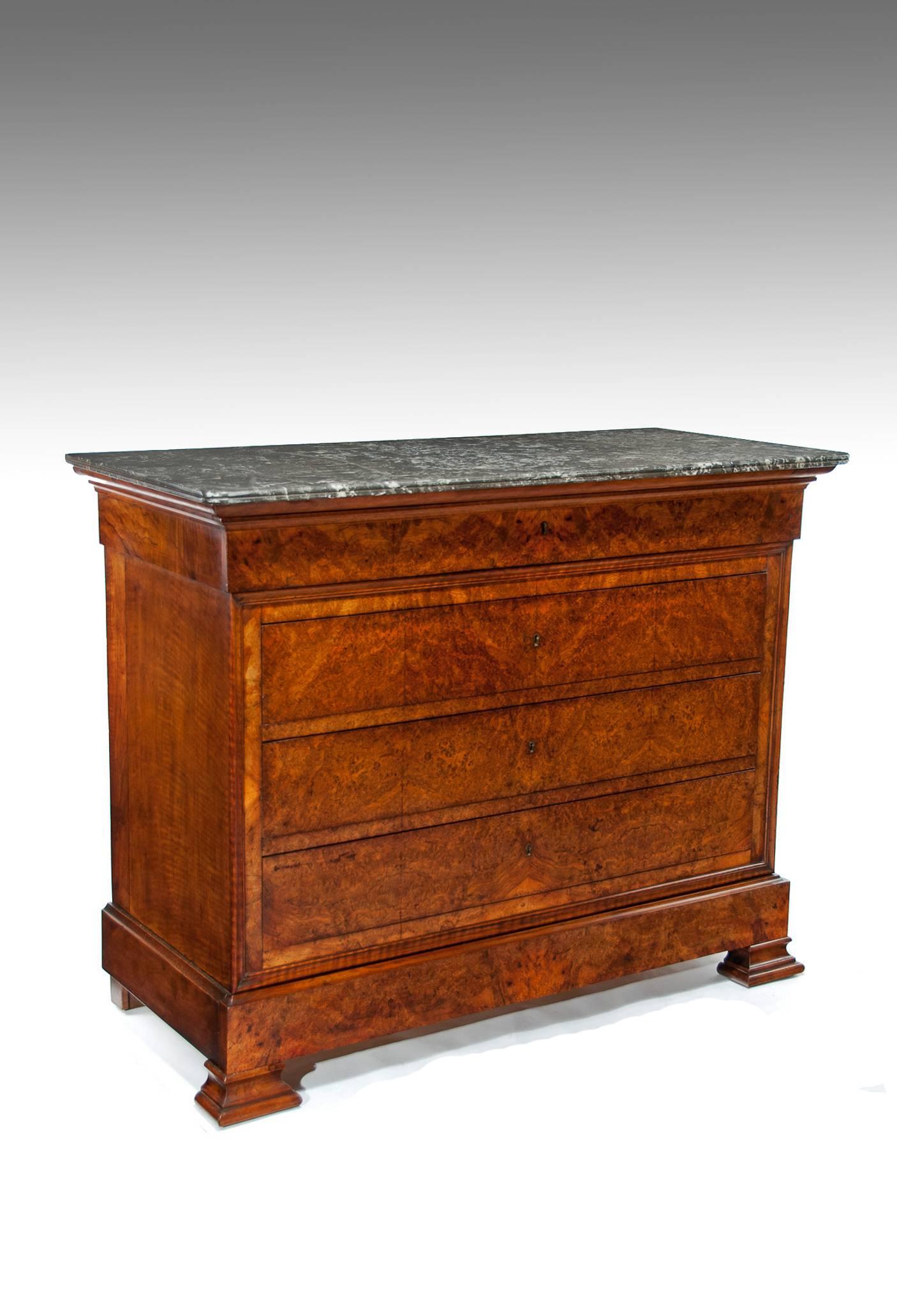 An exceptional quality “Gris St Anne” marble topped French Louis Philippe burr Walnut five drawer commode. 
This antique commode has a beautifully figured grey marble top known as Gris St Anne with a double scrolled edge. 
Having the finest