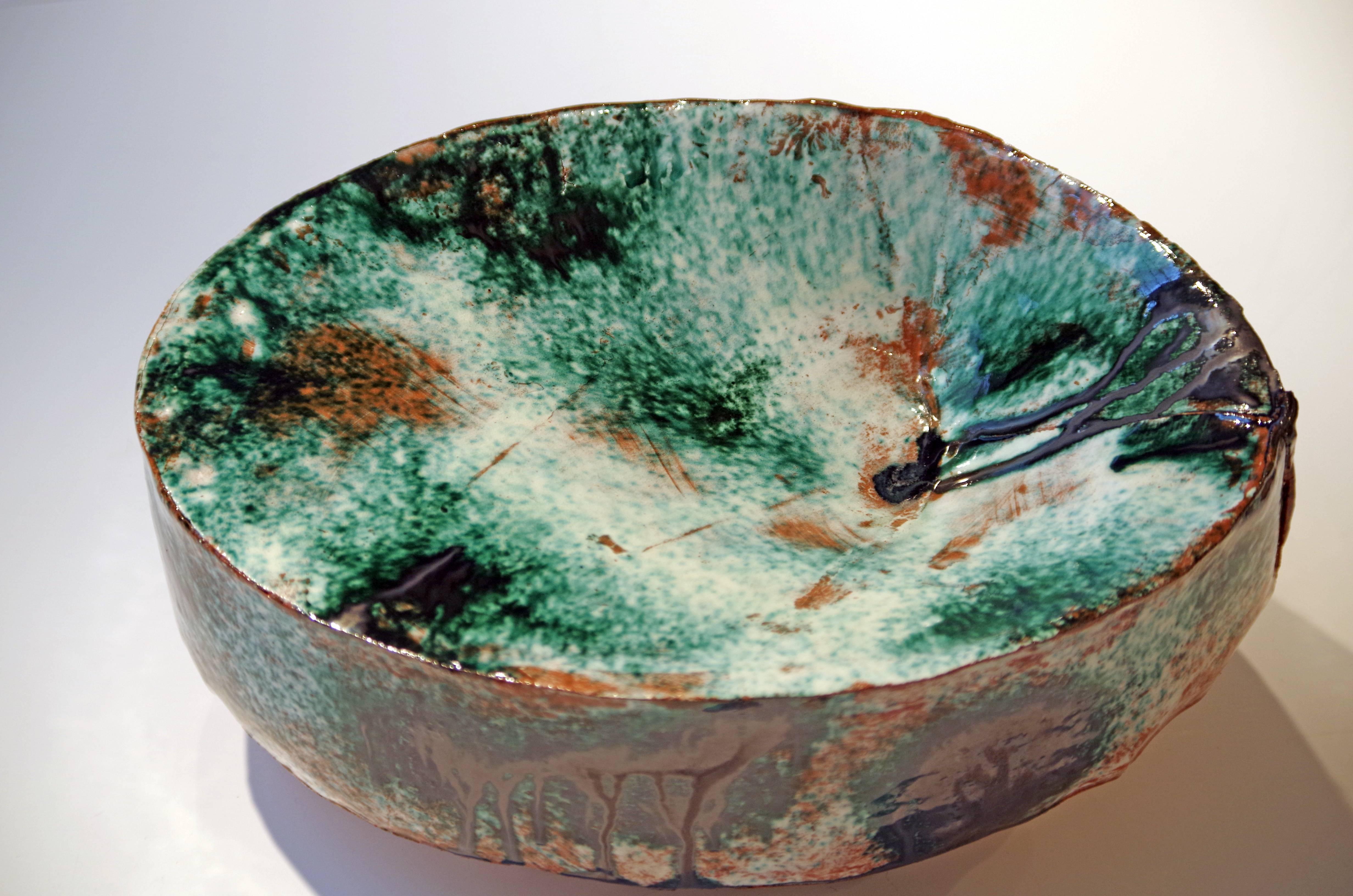 Contemporary ceramicist Brian Molanphy is inspired by the peaks and valleys seen on mountainous hikes. He plays with glazes and firing methods to create unique, contemporary end results that are different for each piece. This swell is formed from
