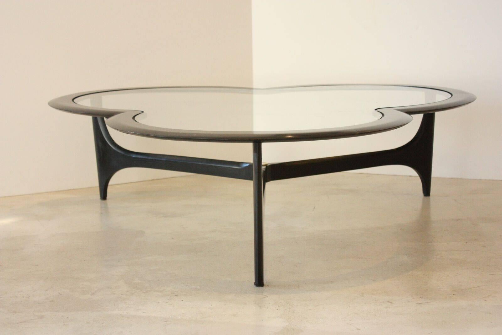 Solid walnut coffee table with inset glass, designed by Adrian Pearsall for Lane, circa 1960s. Solid ebonized walnut table is in the form of a clover leaf and is beveled along the edges. This Classic Mid-Century table is in excellent condition for