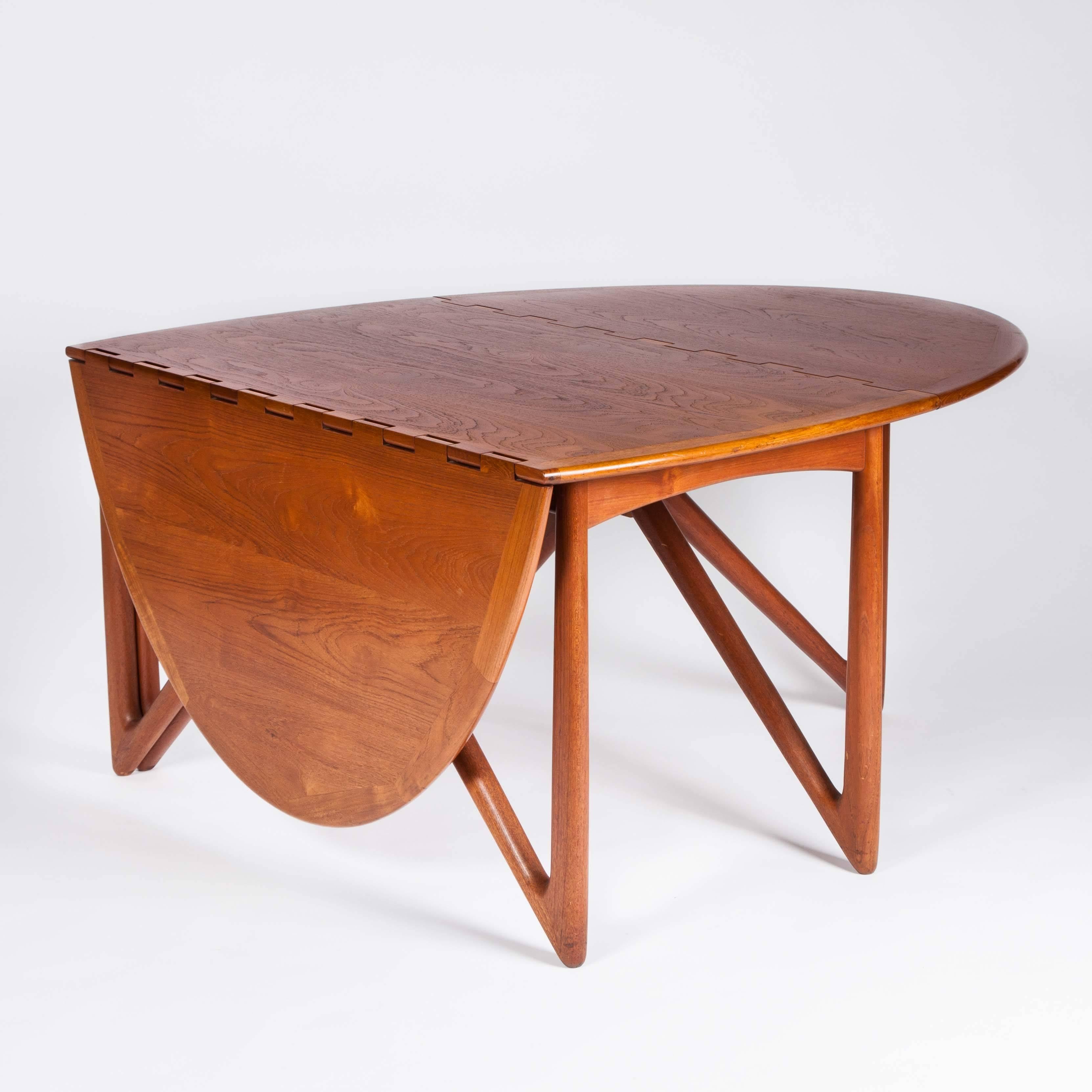 Teak drop-leaf dining table by designed by Kurt Østervig and made by Jason Møbler, circa 1955. 

Literature: Dansk Kunstha°ndværk a°rgang 1953, no. 6, s. 110.

Kurt Østervig (1912–1986) was a noted Danish furniture designer. He trained as a