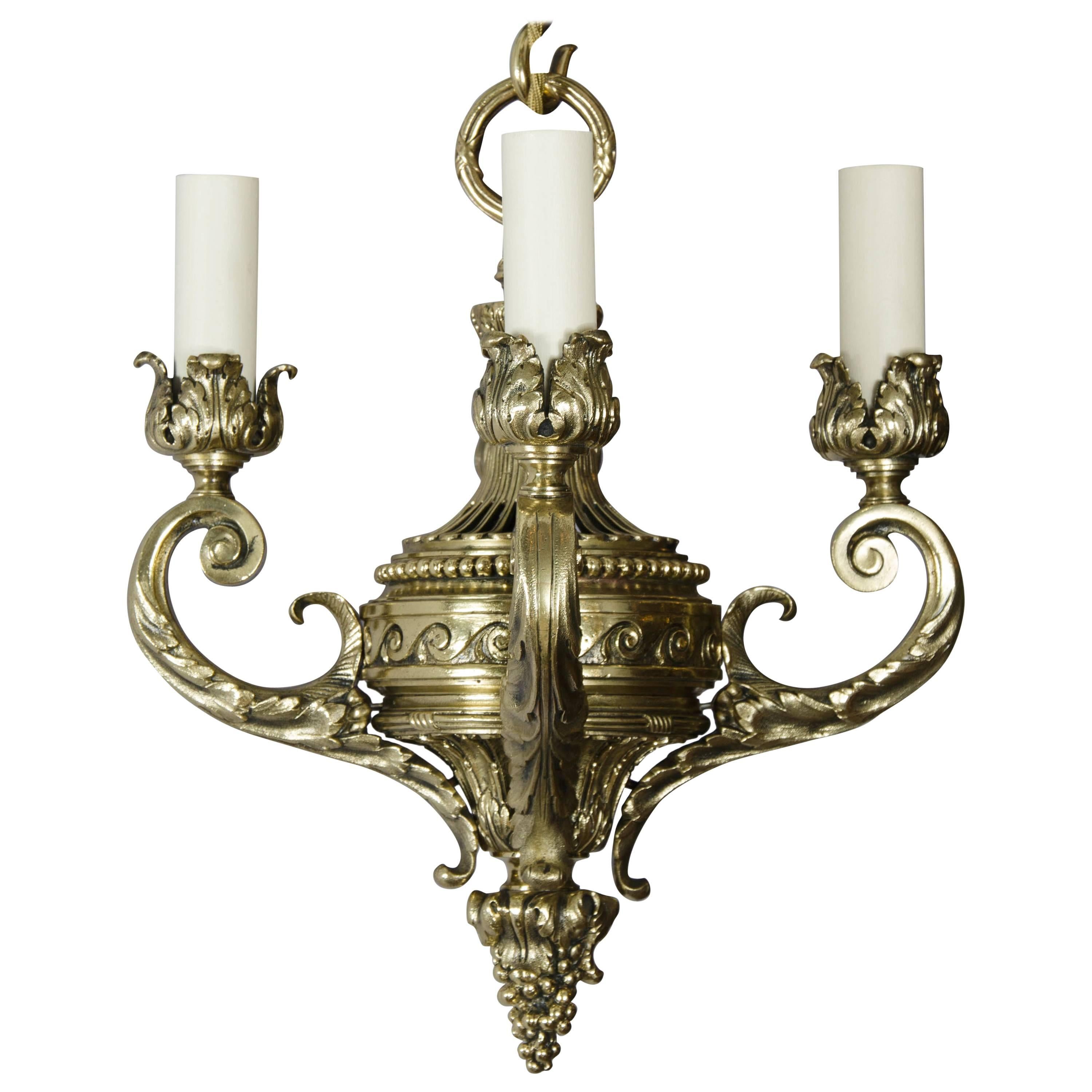 Fine Quality Neoclassical Four Arm Brass Chandelier For Sale