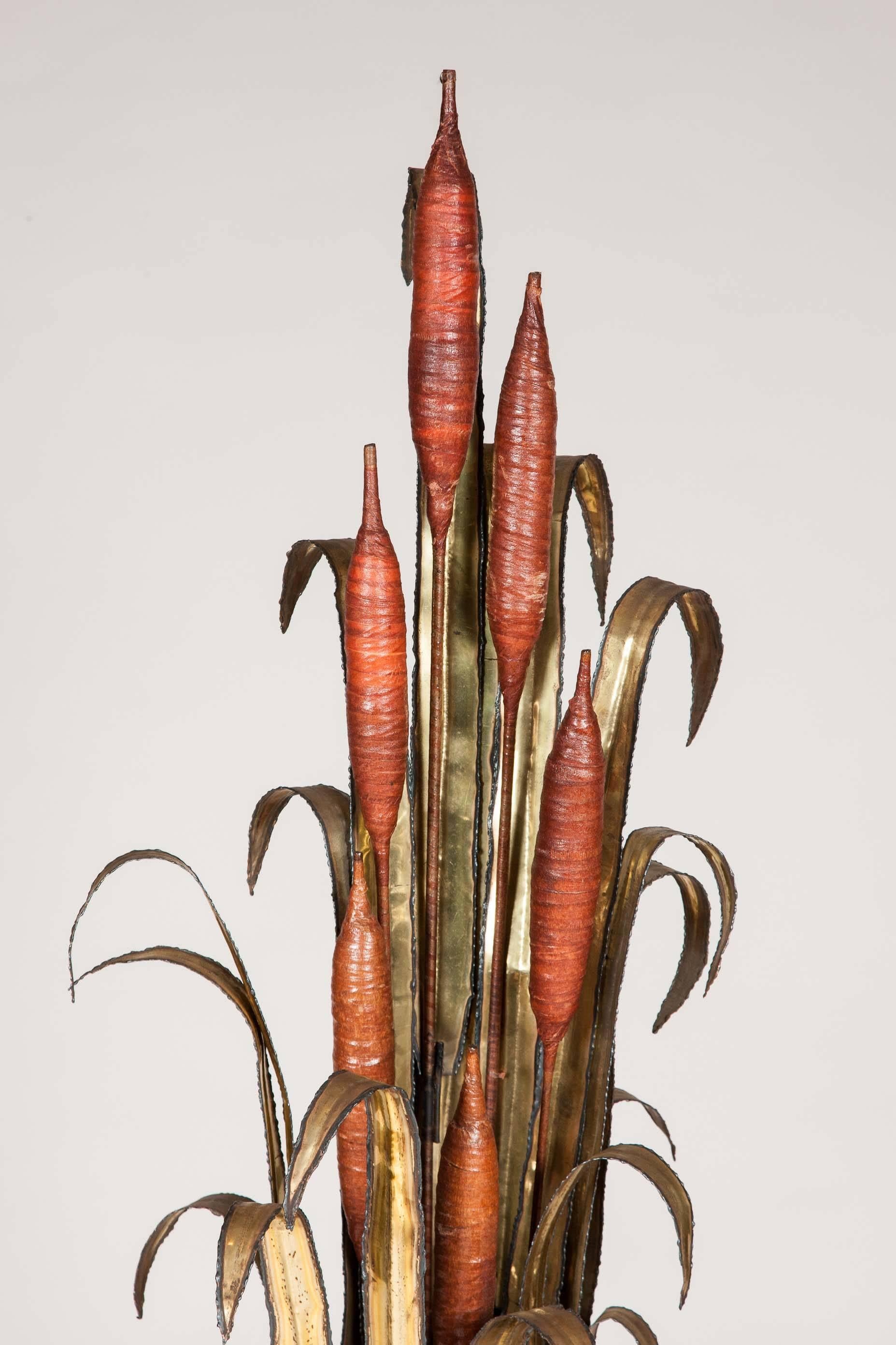 An unusual standing lamp of bull rushes/Cattail and waterlilies with flame cut leaves and resin peddles, attributed to Maison Jansen of Paris.

The Paris-based Maison Jansen was a pioneering design firm active between the 19th and 20th centuries,