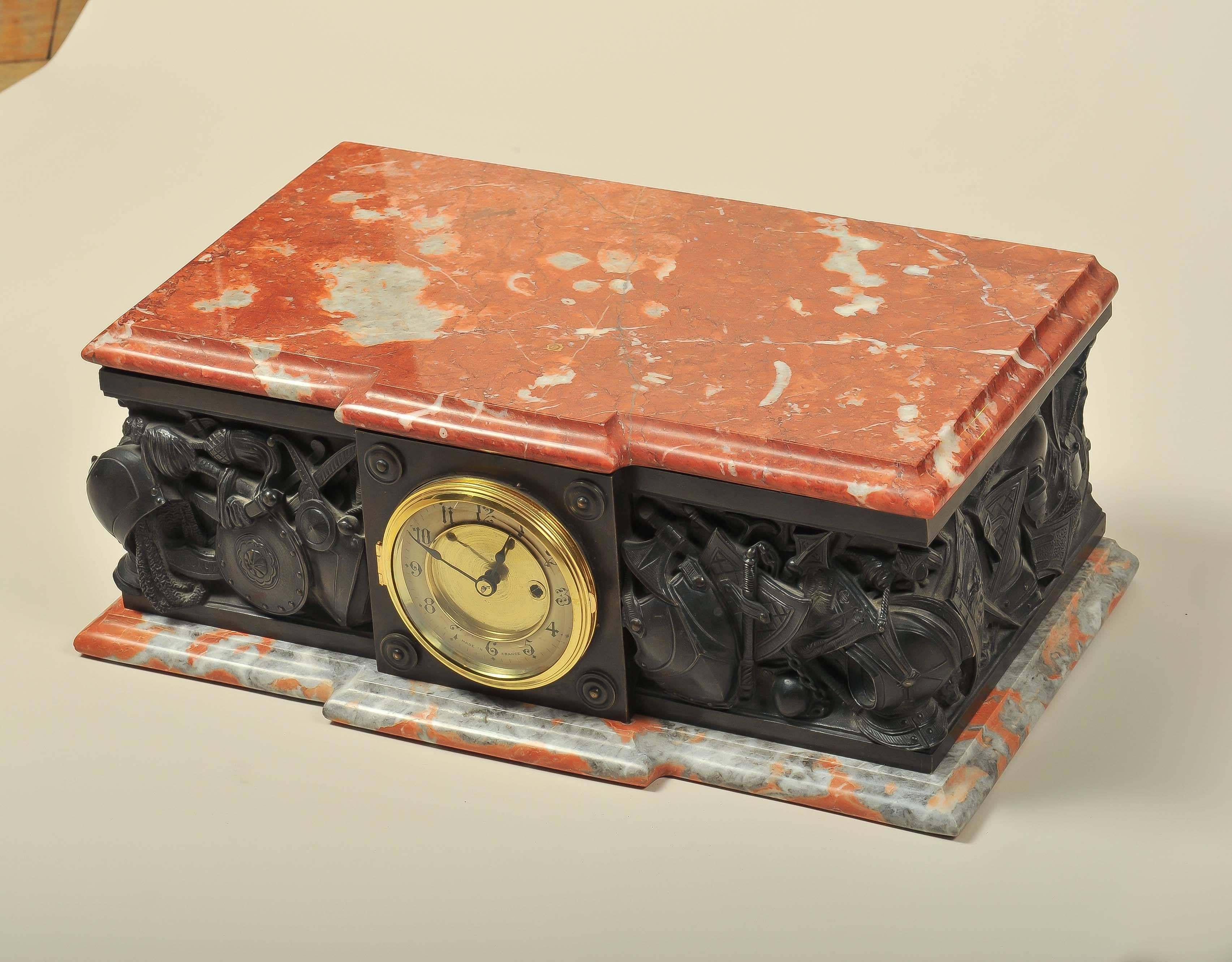 An early 20th century marble and bronze plinth clock.

Detailed bronze work in relief depicting medieval Middle Eastern and European arms and armour.
     