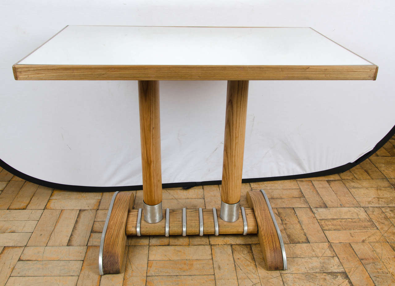 A French bistro table with mirror top and aluminium banding.