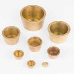 Set of 8 brass Troy ounce nesting standard weights