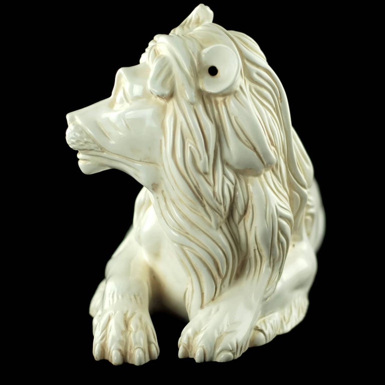 This large majolica lion figurine was made by Porcelain de Cuernavaca for the Mottahedeh company, known for their ceramic antique reproductions and historic designs. The design was originally executed in the early 18th century by head modeler for