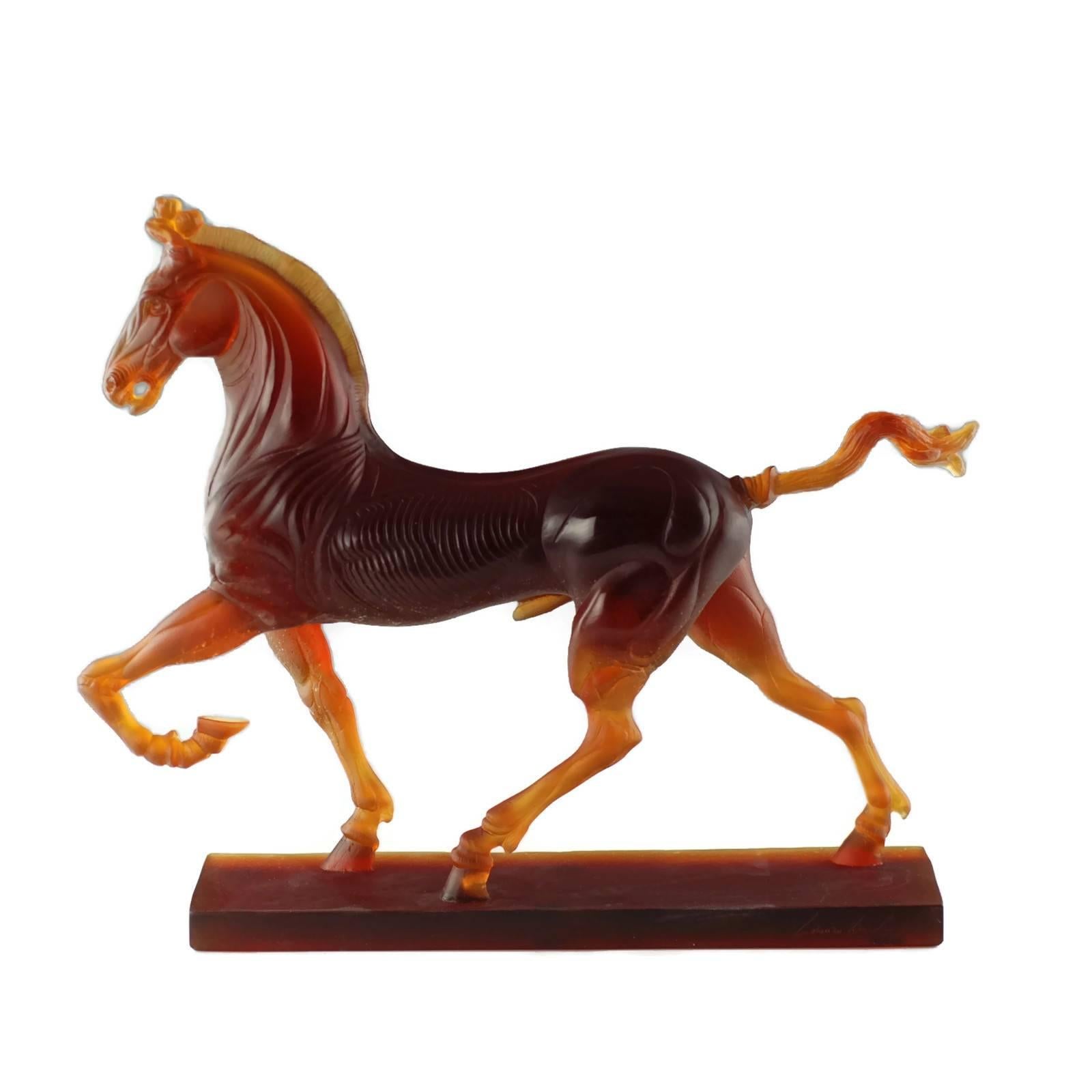 This large limited edition pâte de verre equine sculpture was designed by Ludovico De Luigi (b. 1933) for Daum Nancy and depicts a stallion standing on a rectangular plinth. The highly detailed piece has a stylized form which emphasizes the