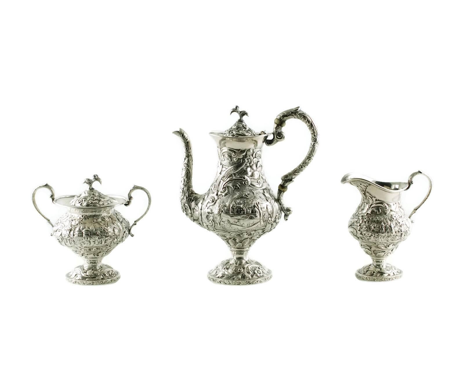 Early 20th Century Sterling Silver Loring Andrews Three-Piece Repousse Castle Pattern Tea Set