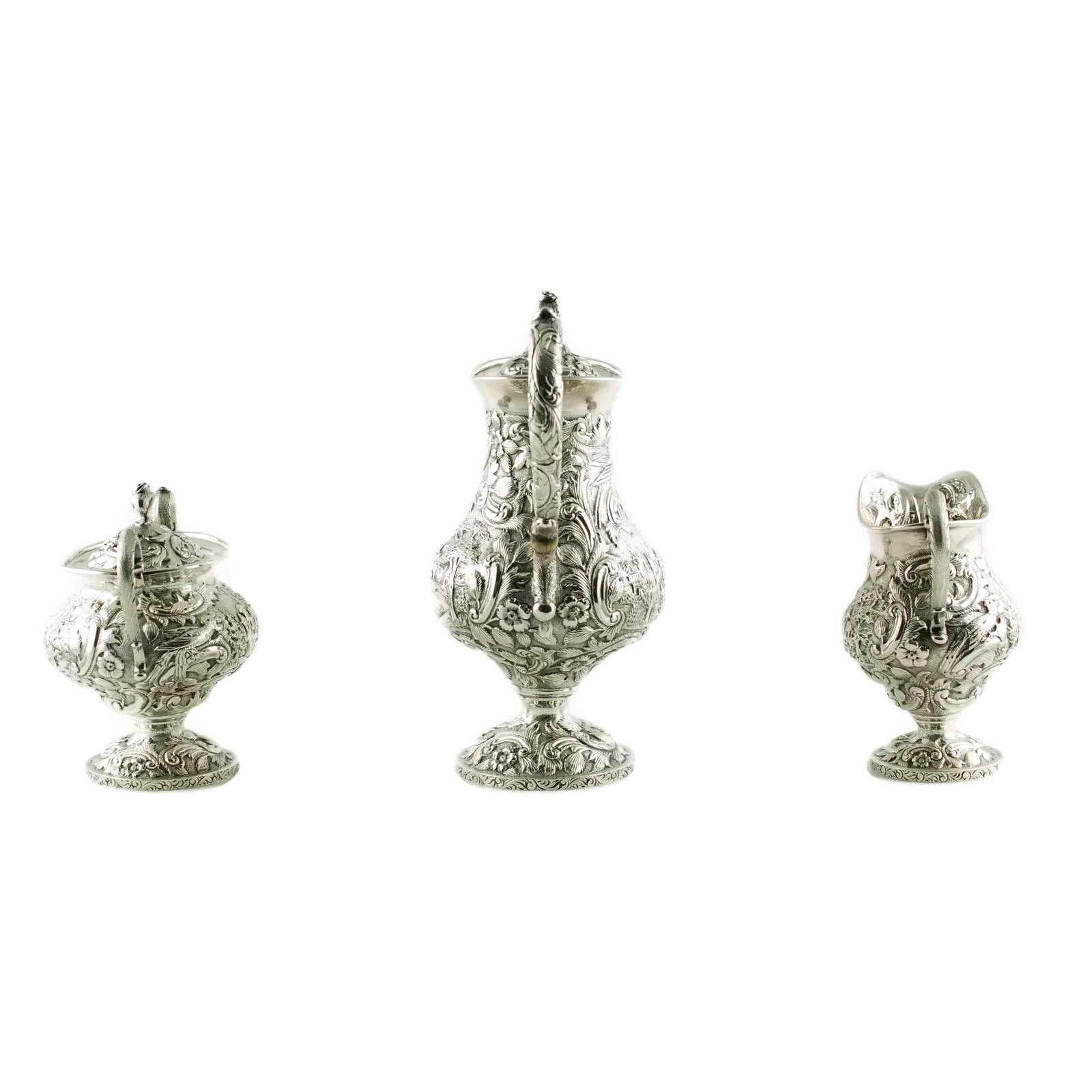 Sterling Silver Loring Andrews Three-Piece Repousse Castle Pattern Tea Set In Excellent Condition In Cincinnati, OH