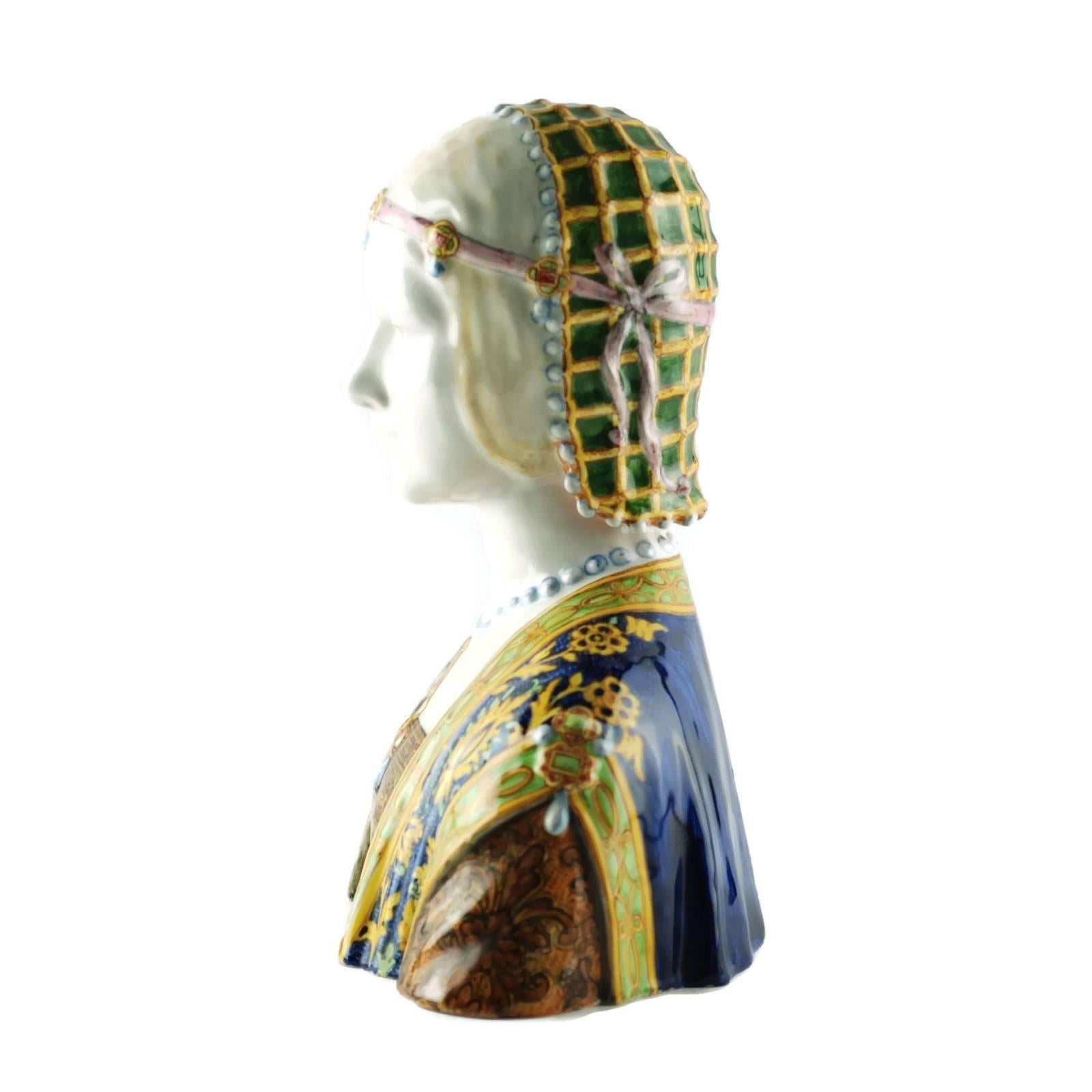This hand-painted Majolica bust was made by the renowned Italian ceramics manufactory, Angelo Minghetti & Figli. Founder Angelo Minghetti (1822-1885) is particularly well-known for his Majolica busts, Madonna figures and Della Robbia style