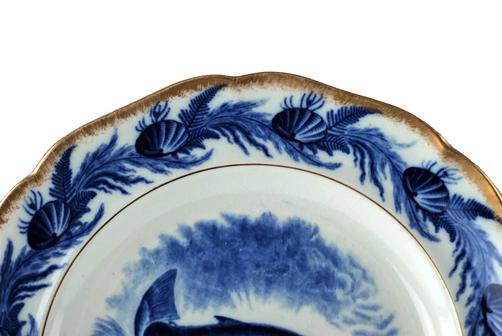 Glazed Set of 12 Gilt Edged Cauldon England Flow Blue Fish Plates with Oval Platter