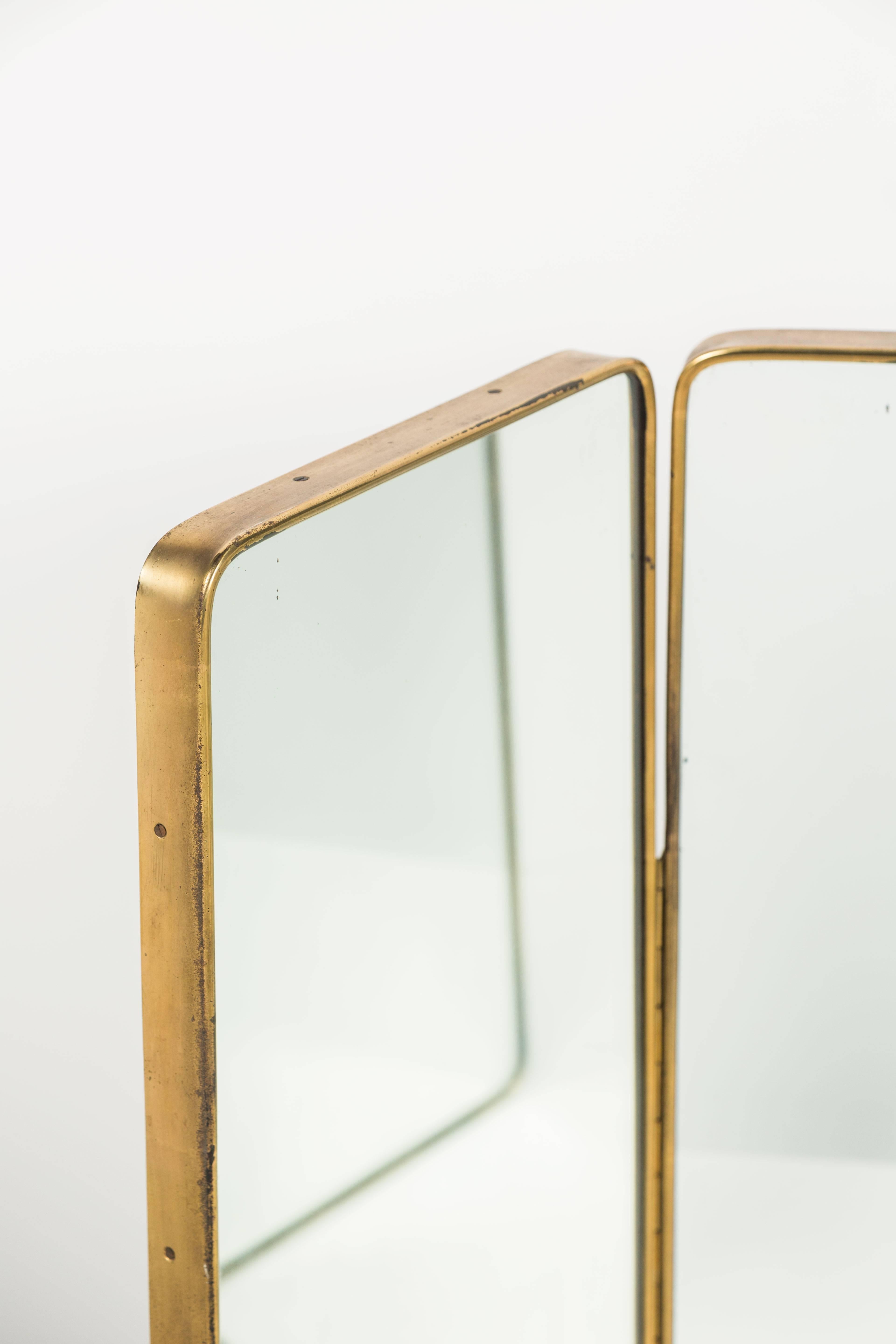 Italian brass tri-fold, three-way hinged table vanity mirror, Made in Italy, circa 1960s.
