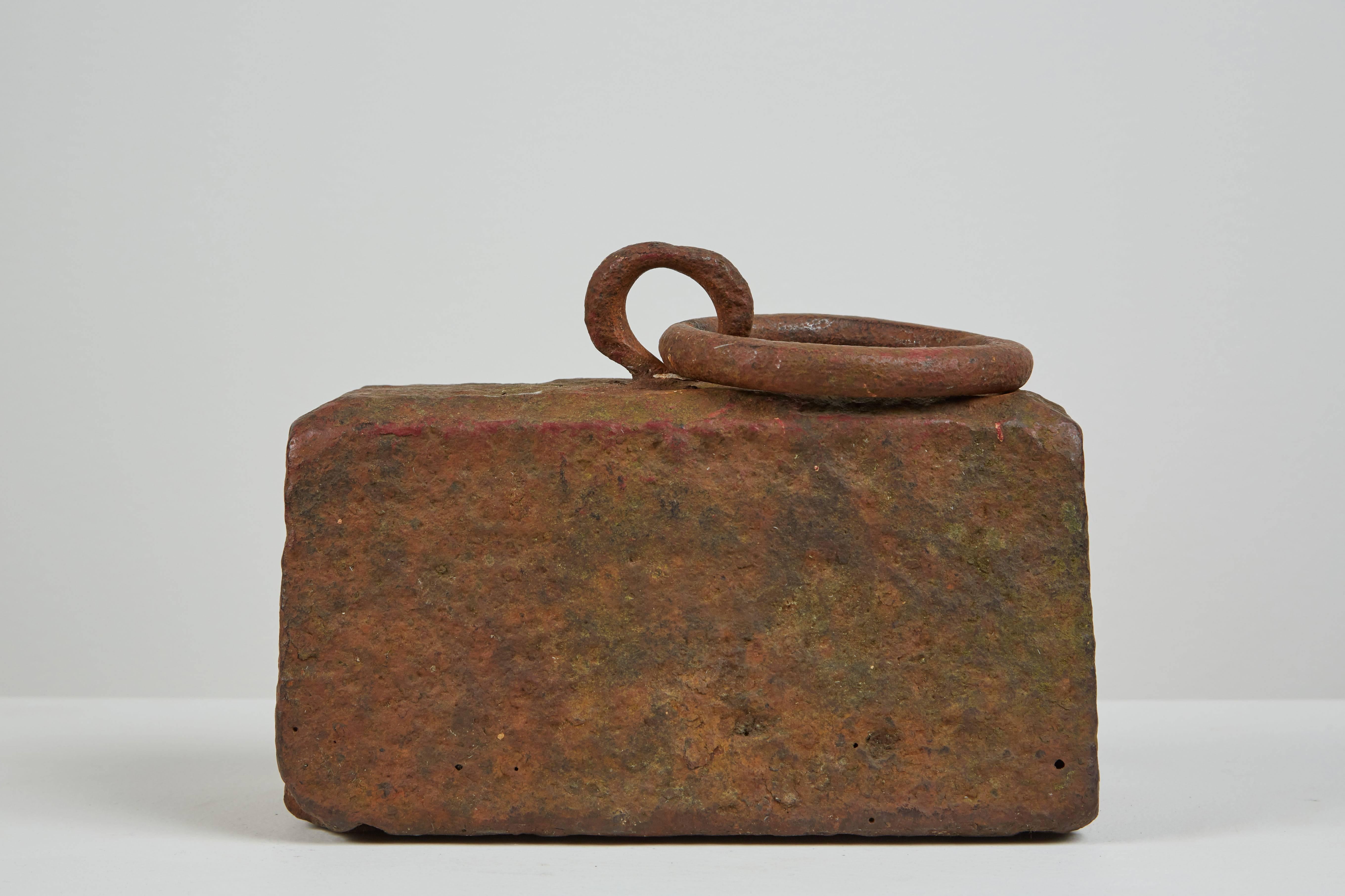 Hand-wrought iron horse tether with heavy patina. Can be used as a doorstop or sculpture. Made in USA, circa 1850s.