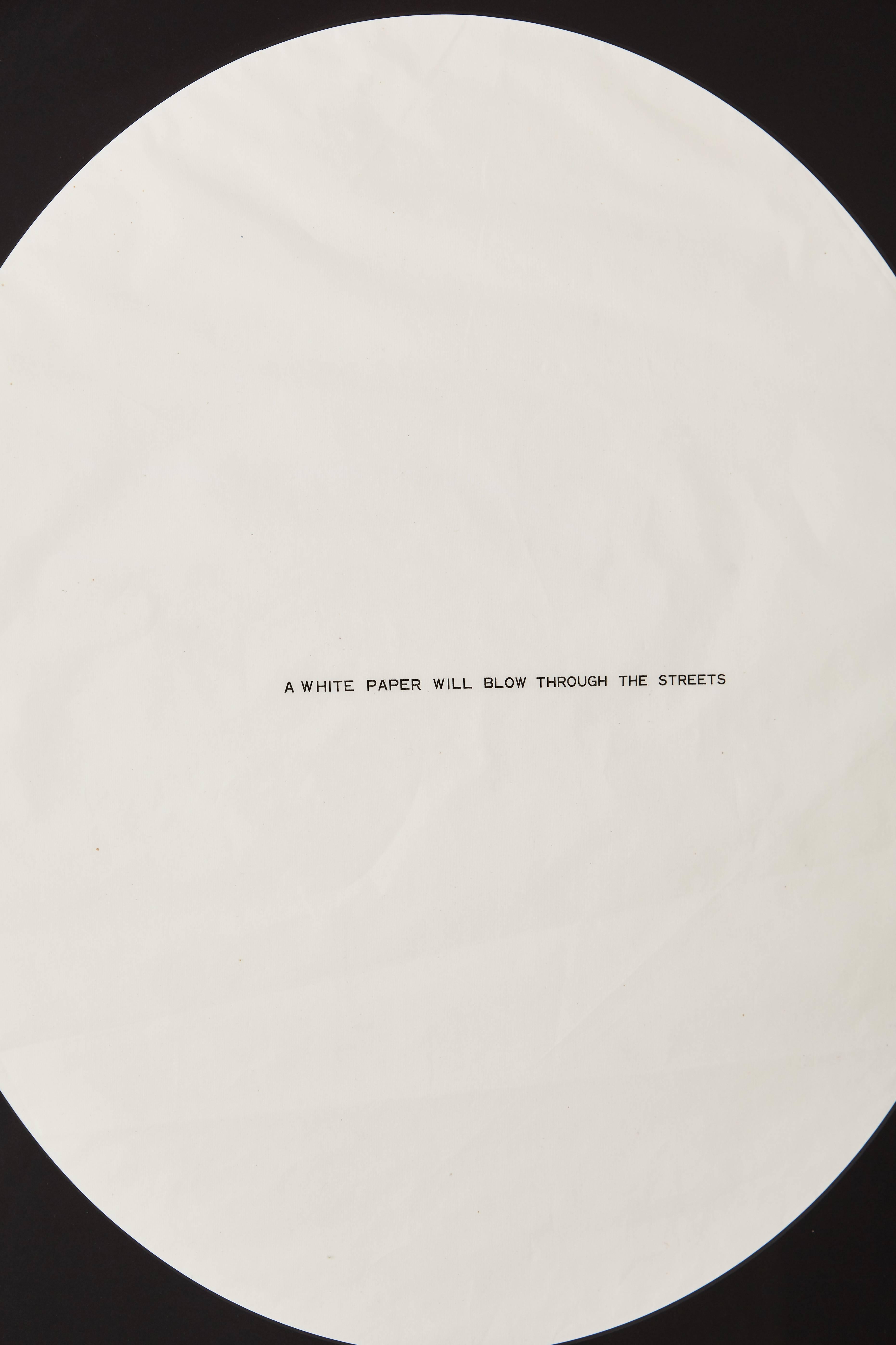 Framed Offset lithograph ephemera printed in black on white Japanese paper sheet. 

James Lee Byars printed the words “A White Paper Will Blow Through The Streets” onto a large disc of Japanese paper, one example of which is also said to have been