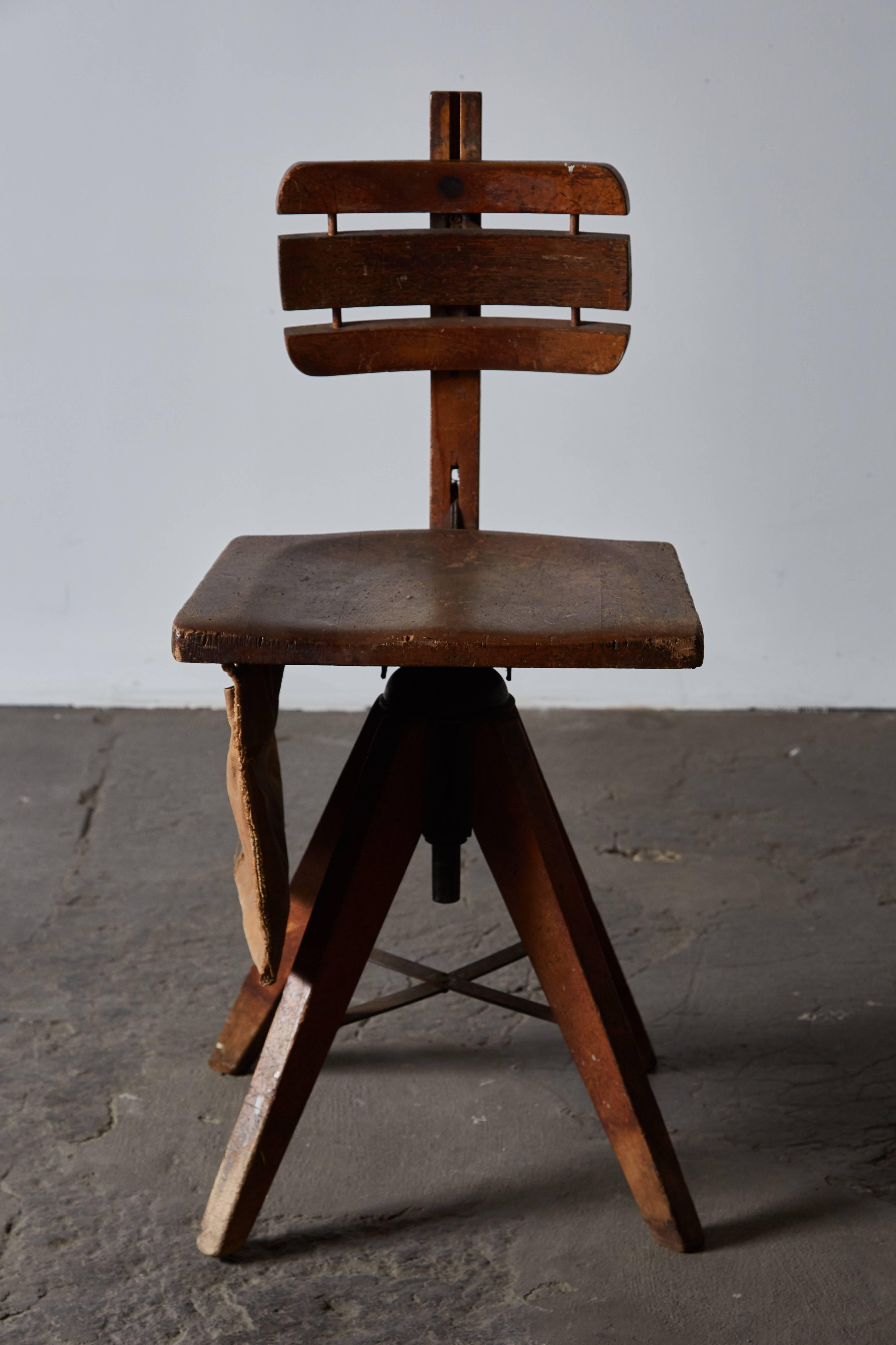 Industrial wooden desk/side swivel chair with adjustable back and canvas bag by Cook Cambridge. Made in USA, circa 1920s.