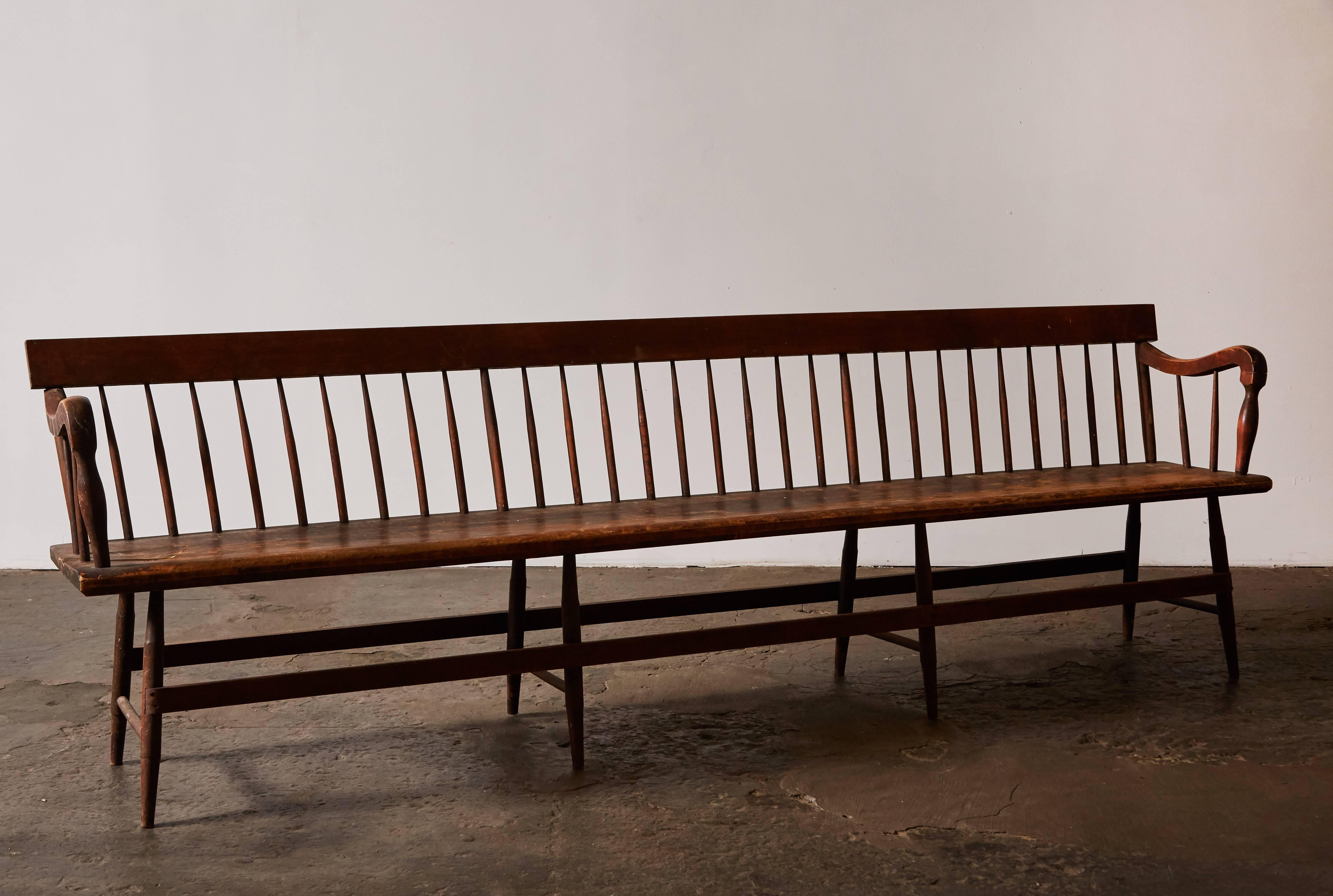 Extra-long spindle Deacon's bench with New Hamspshire birch and mahogany. Made in USA, circa early 20th century.