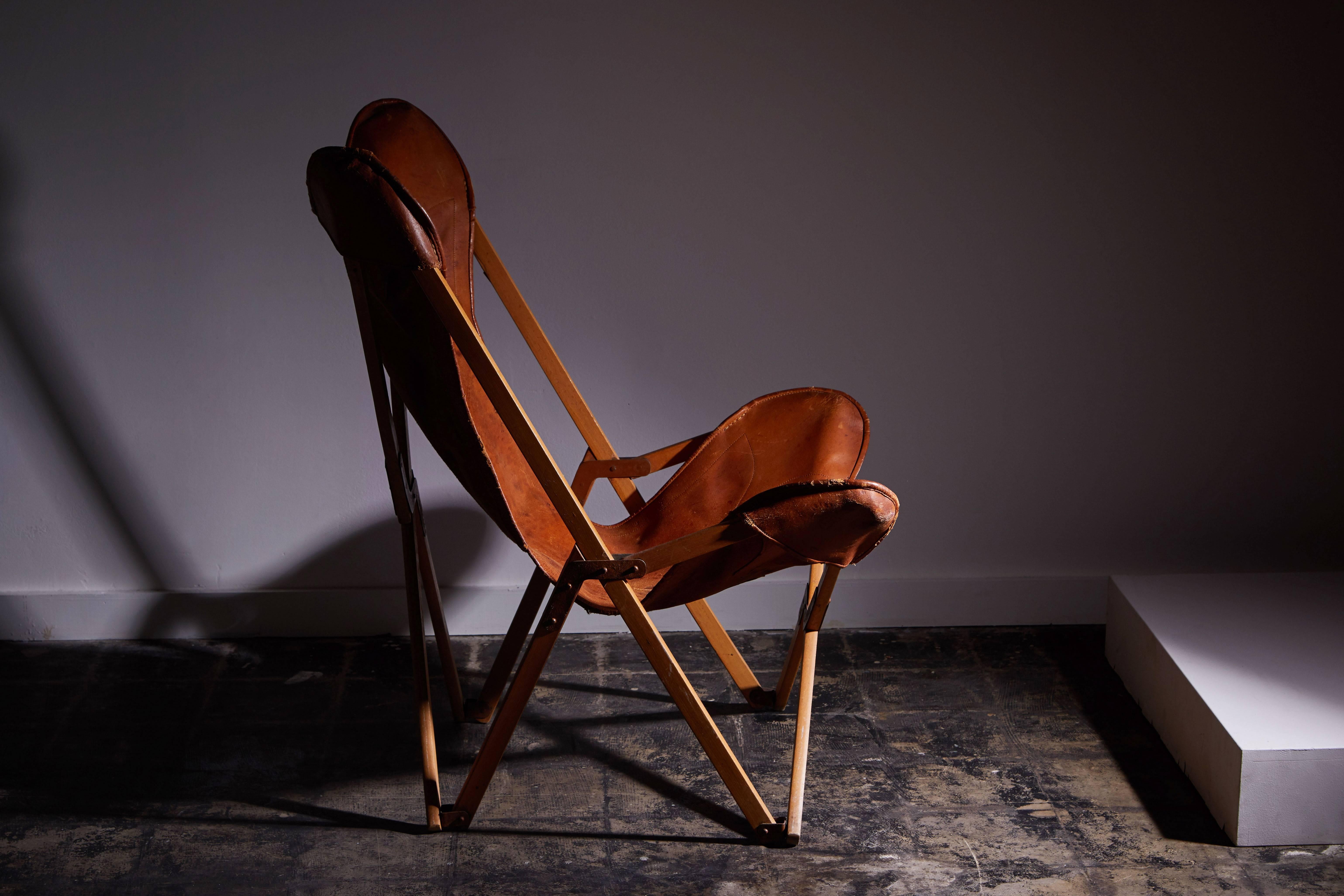 Rare patinated leather folding Tripolina chair designed by Joseph Fendy for Vigano. Made in Italy circa 1930s.