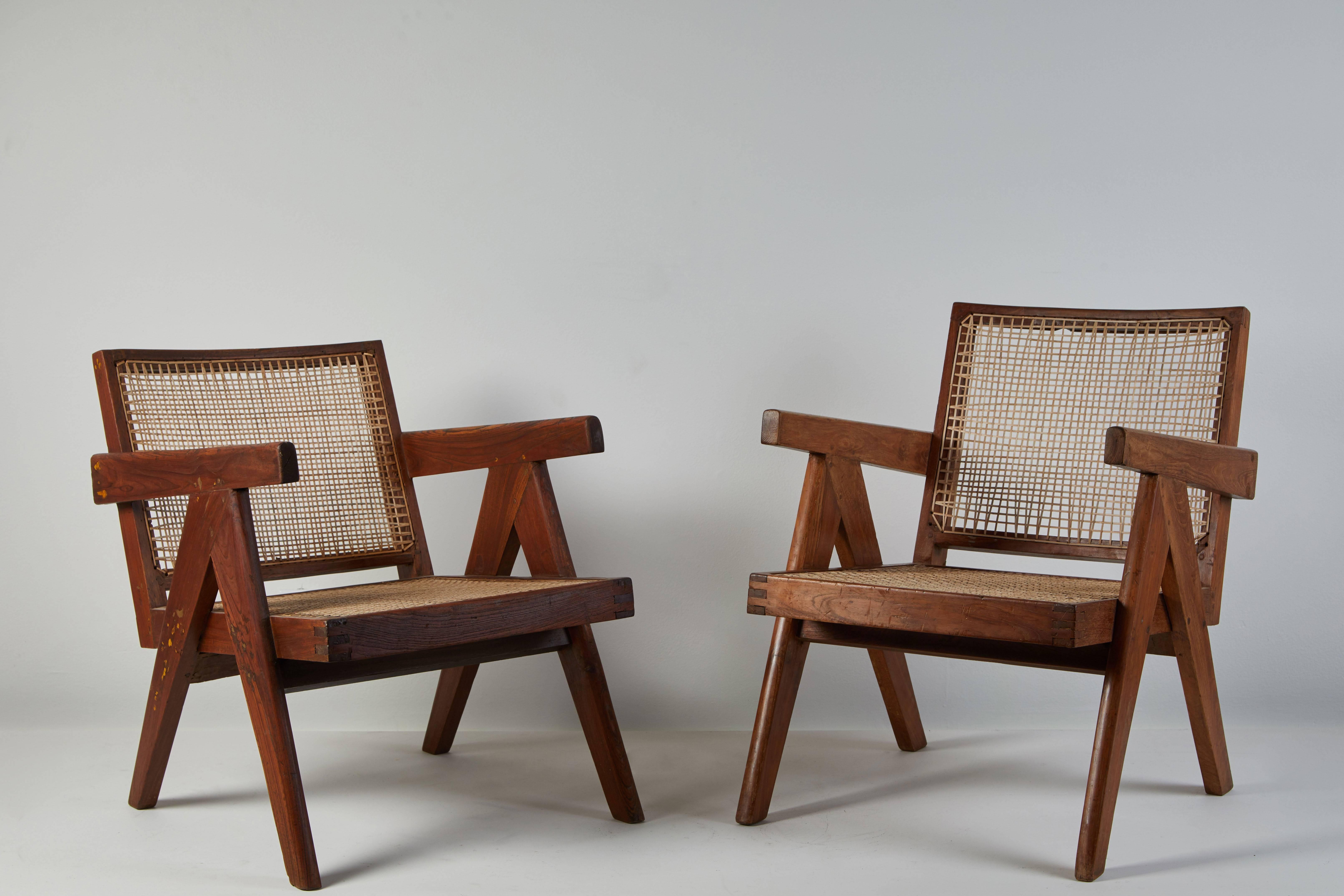 Cane and teak Easy Armchairs by Pierre Jeanneret for Punjab University in Chandigarh. Made in India/France circa 1956.

Available with cushion.
