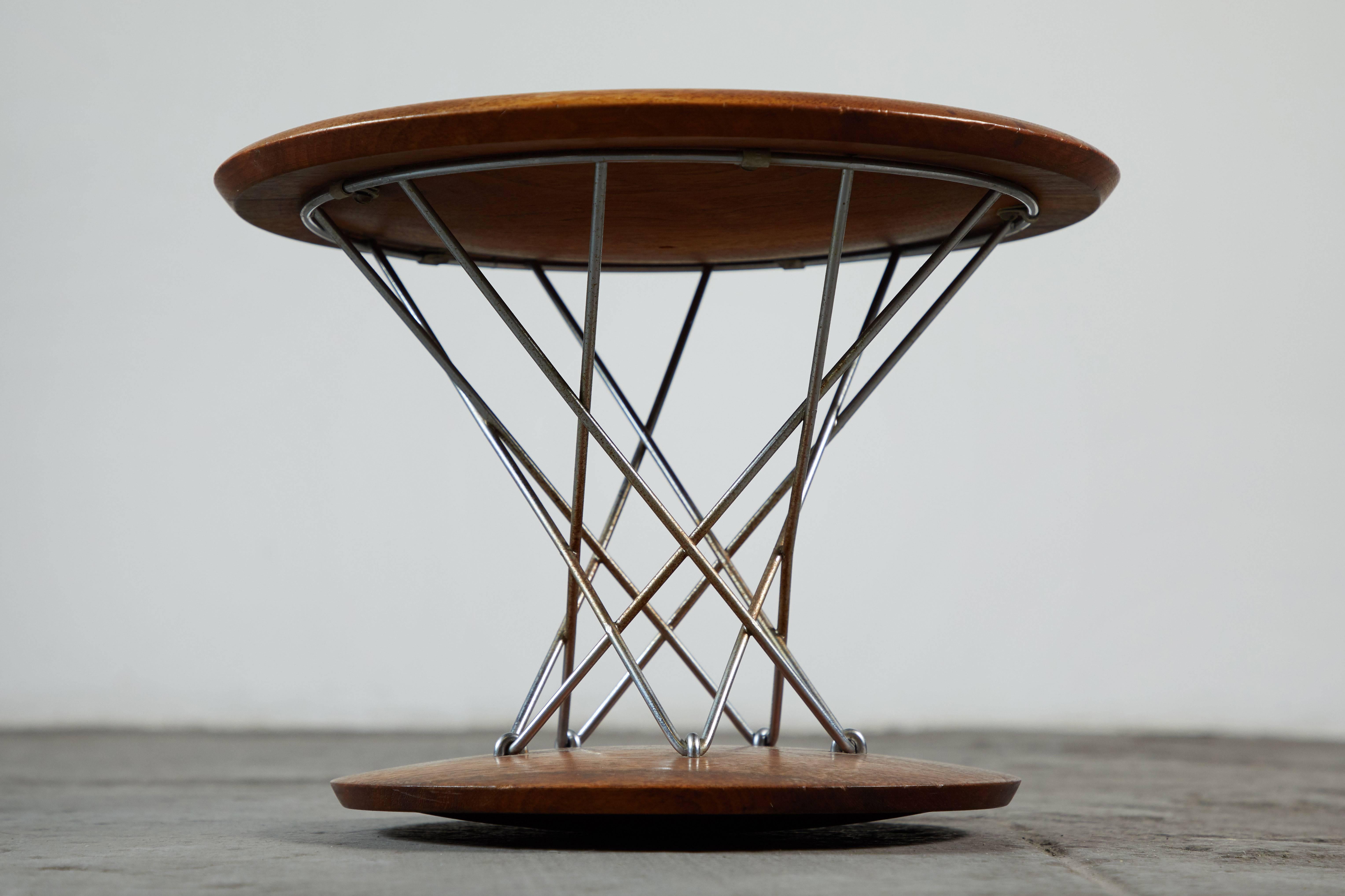 Early walnut rocking stool by Isamu Noguchi for Knoll. Made in USA, circa 1955.

  