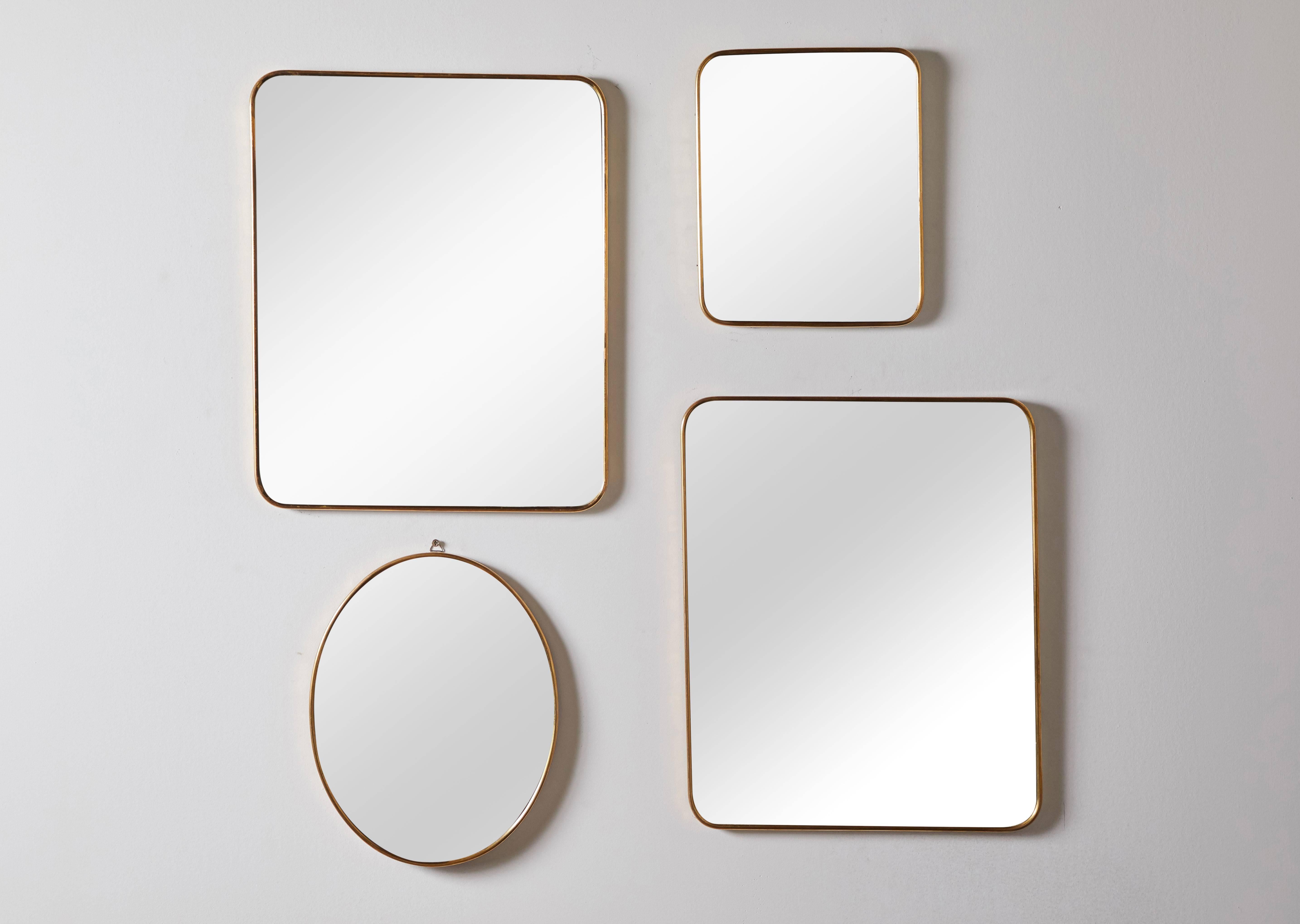Italian brass framed wall mirrors. Made in Italy circa 1960s. Each item is sold separately. Dimensions and prices vary.  Dimensions:
Large Rectangular (2) 16.5” H x 13.5 W x .5” D $1800
Small Rectangular 10.5” H x 8.5” W x .5” D $1400
Oval 12” H x